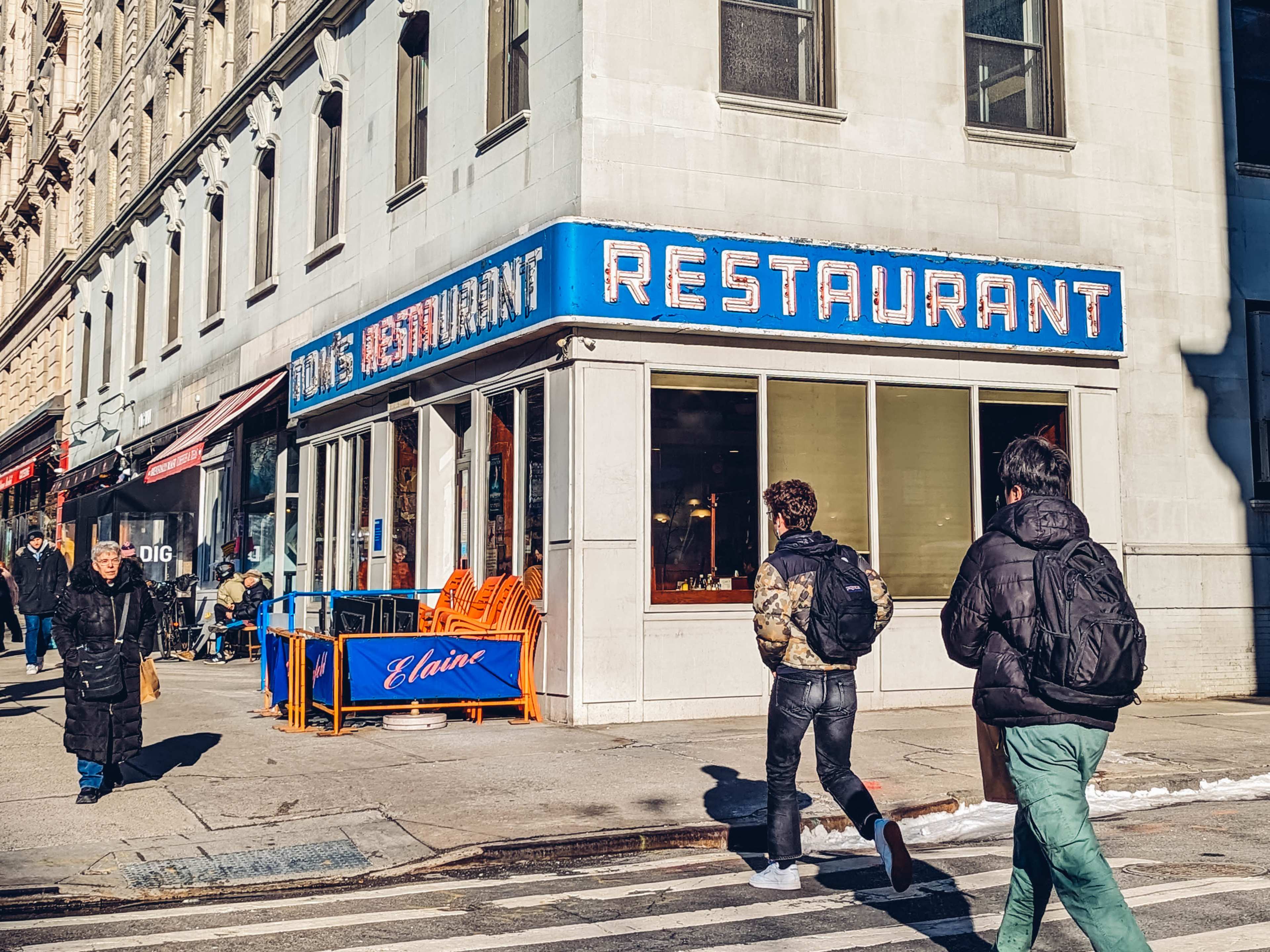 exterior of tom's restaurant with burnt-out neon sign