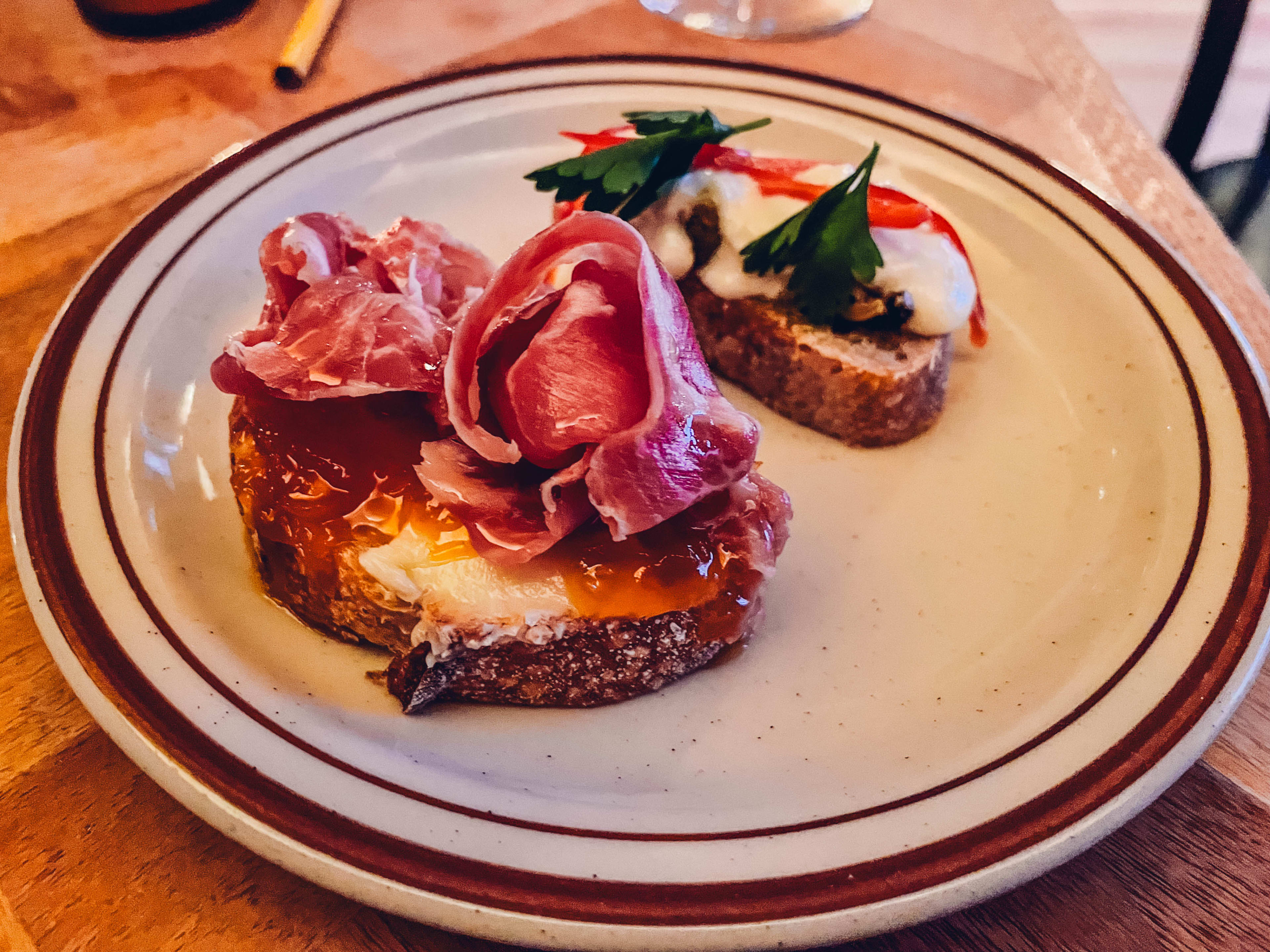 a country ham and mussel toast from vino vino