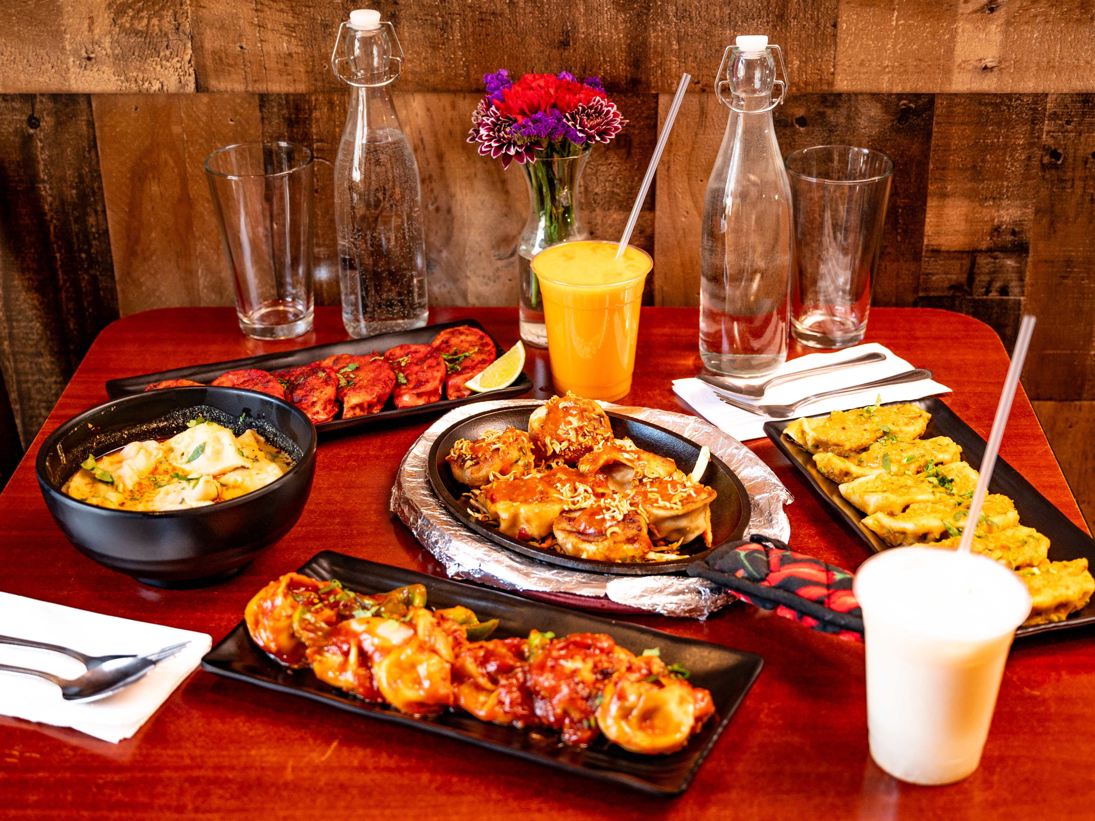 This is a food spread pic at Nepali Momo Kitchen.