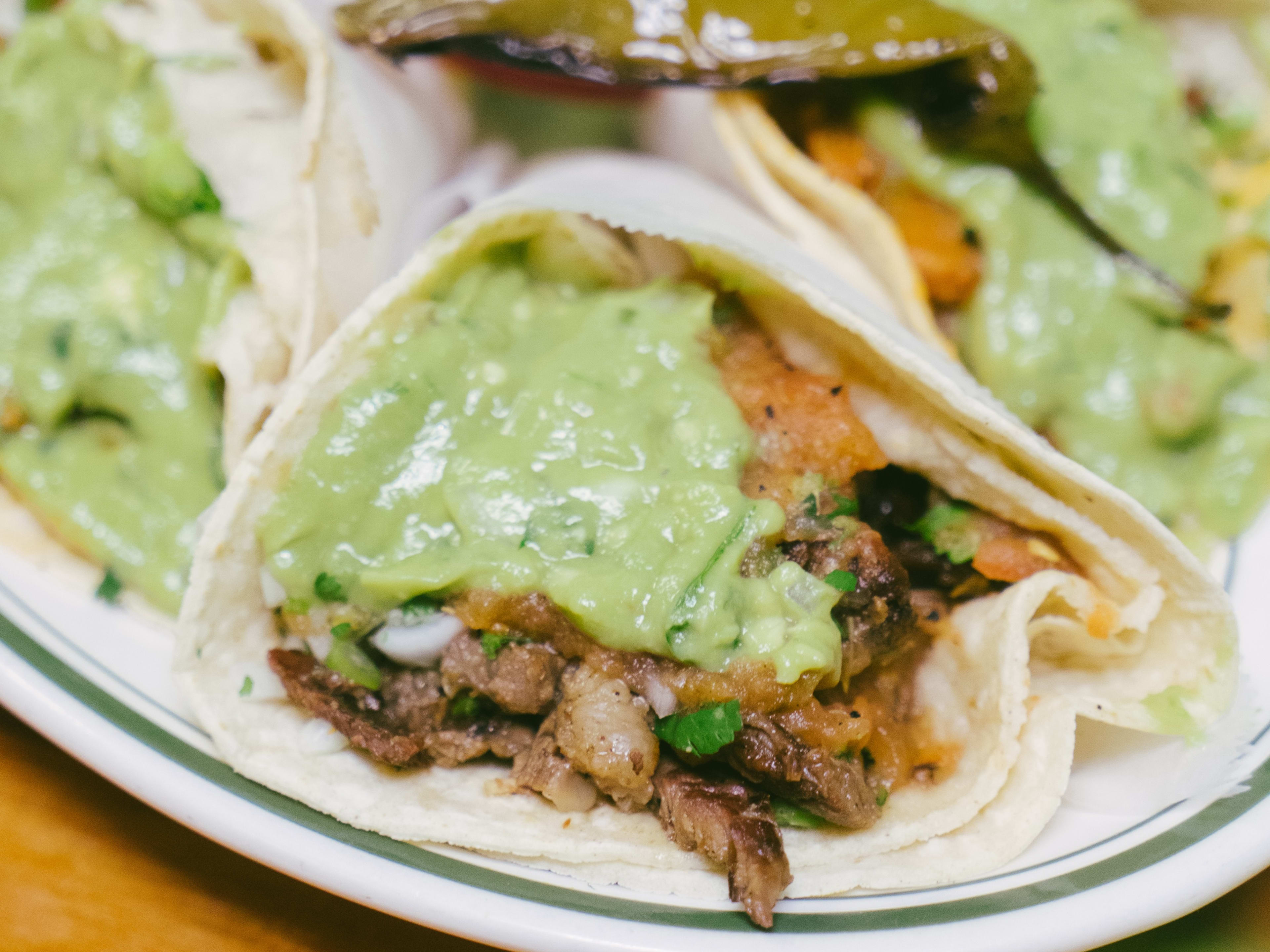 A salsa verde covered taco from Taqueria Coatzingo.