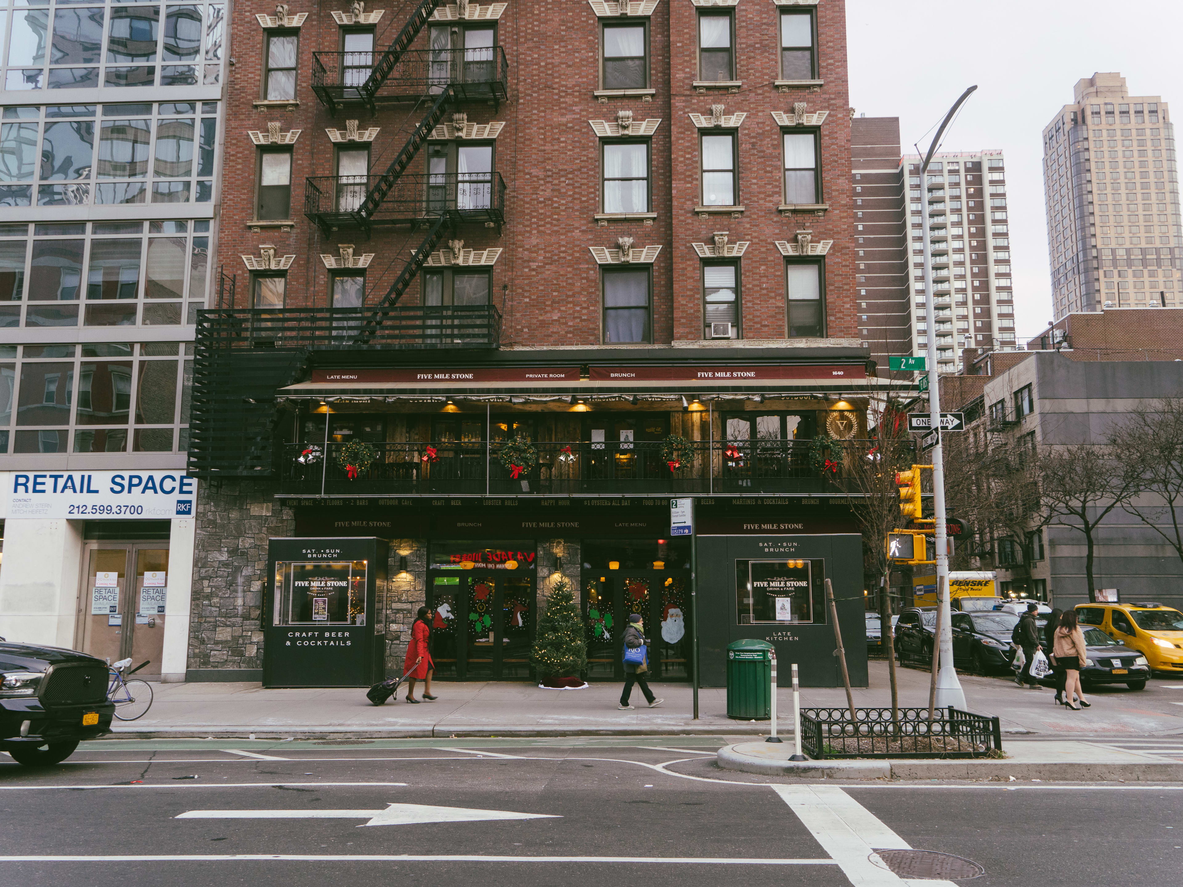 The exterior of Five Mile Stone, a two-story pub on a corner of the Upper East Side.