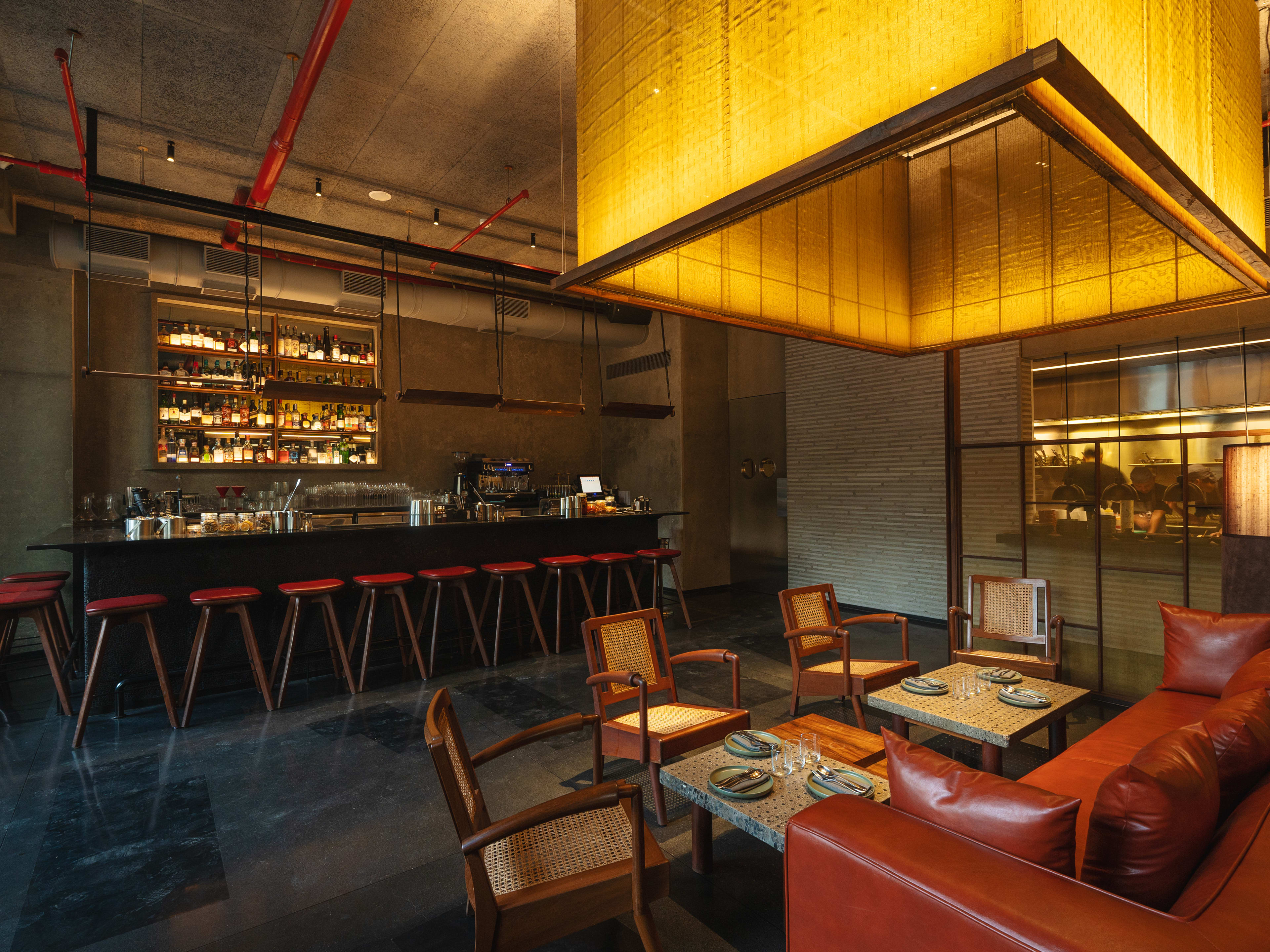 Interior bar and lounge space in dim lighting at Ode