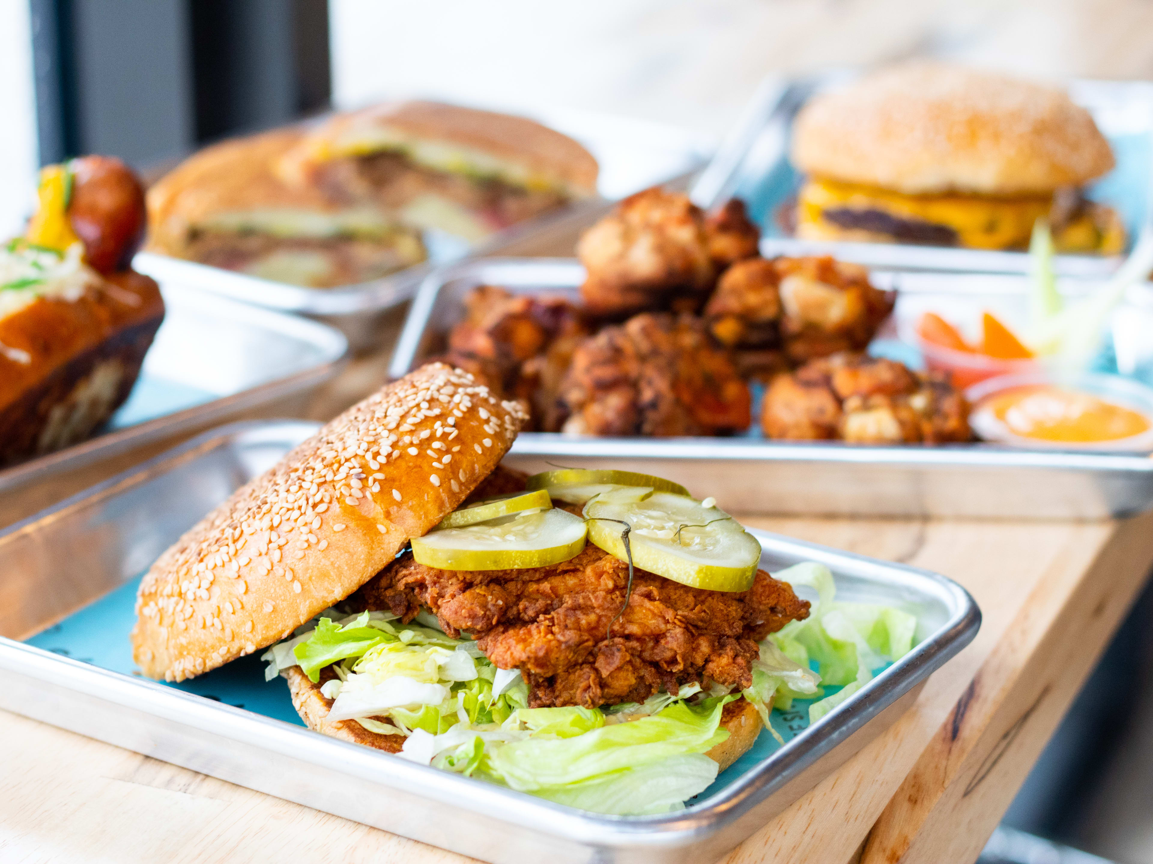 A fried chicken sandwich on a table.