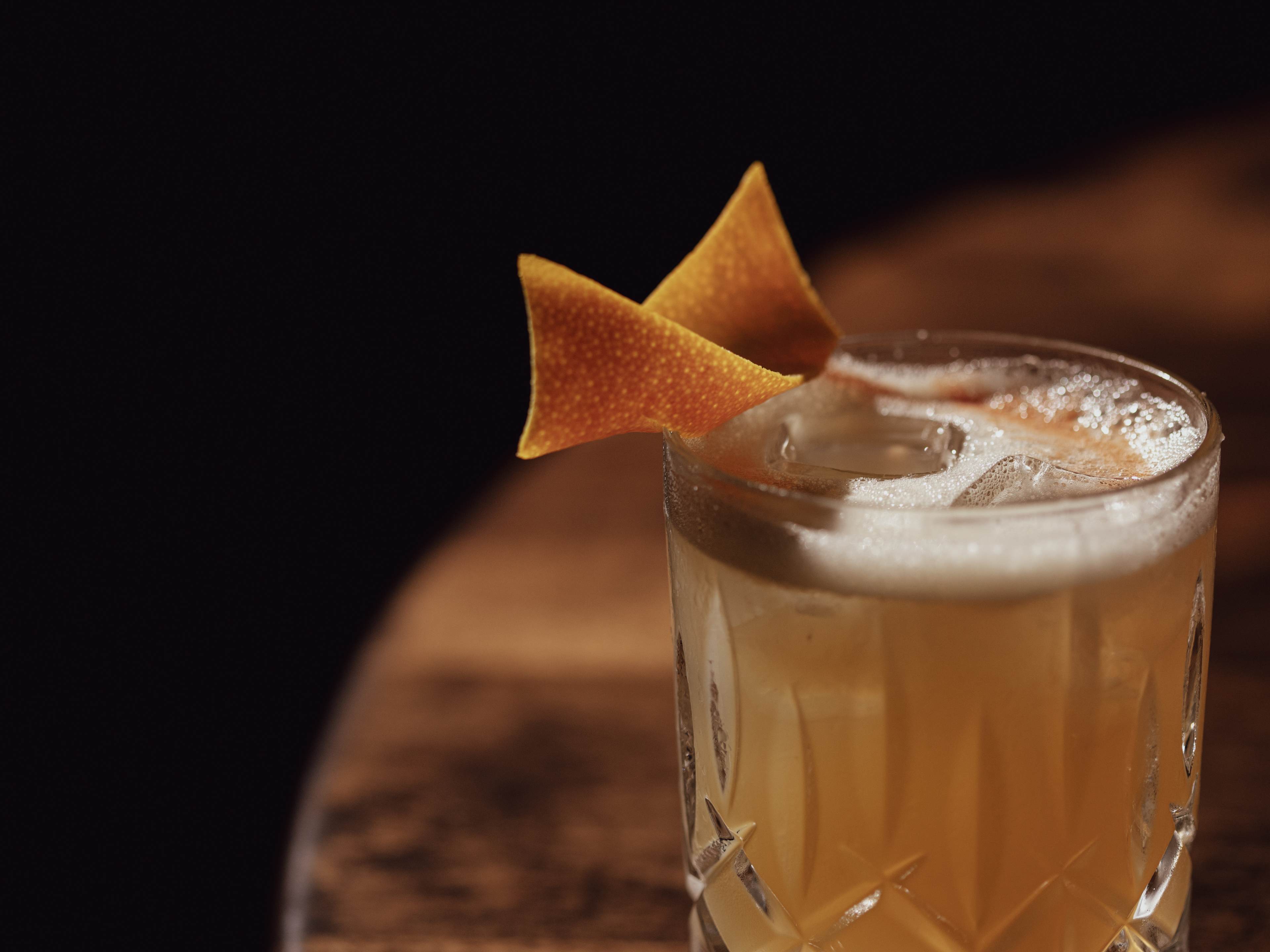 cocktail with orange peel garnish