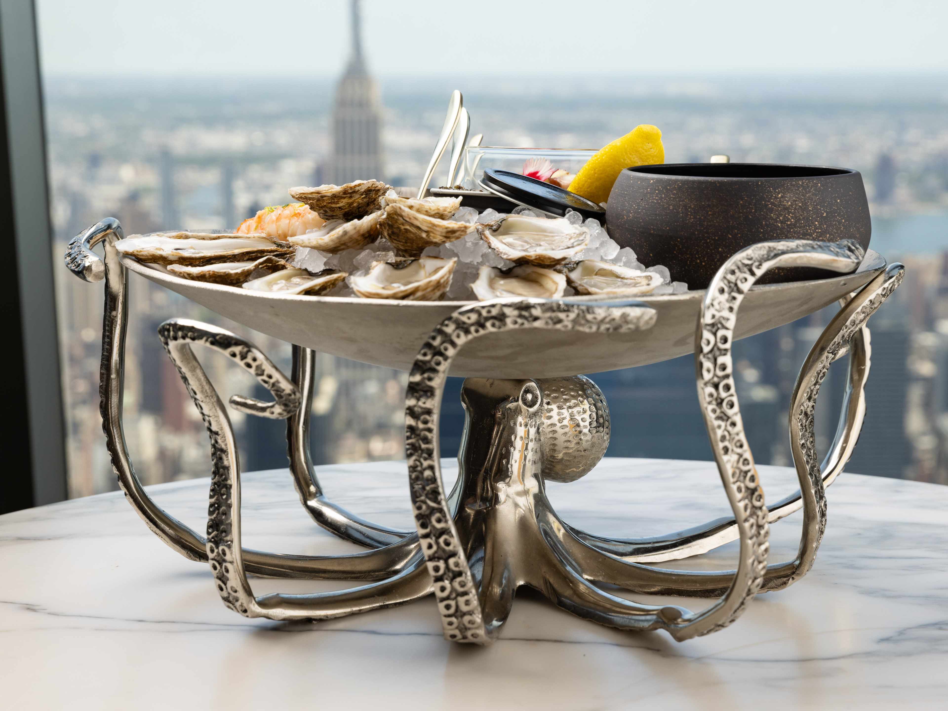 A silver seafood platter shaped like an octopus.