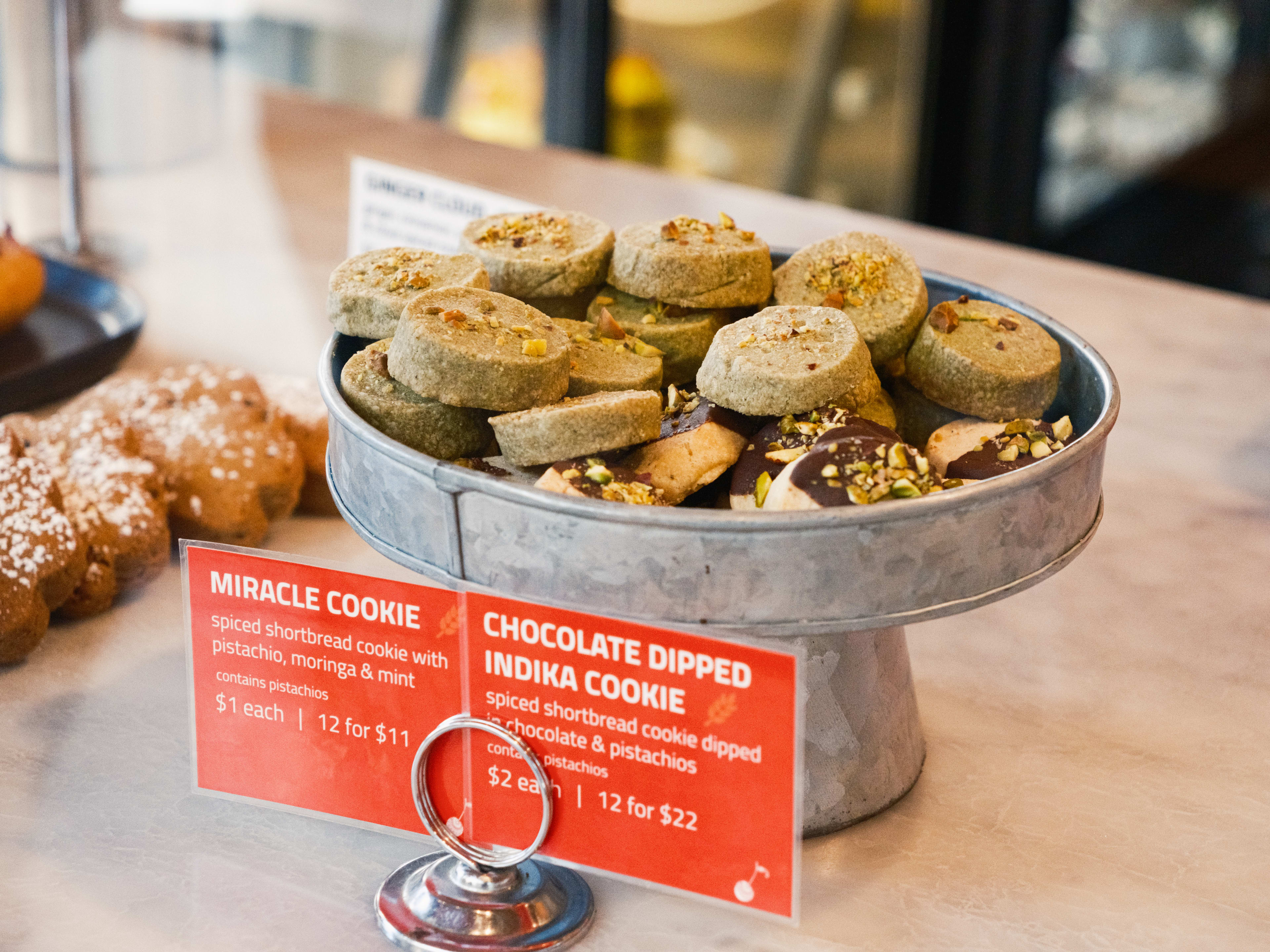 The miracle cookies and chocolate dipped indika cookies in the pastry case at Pondi Bake Lab.