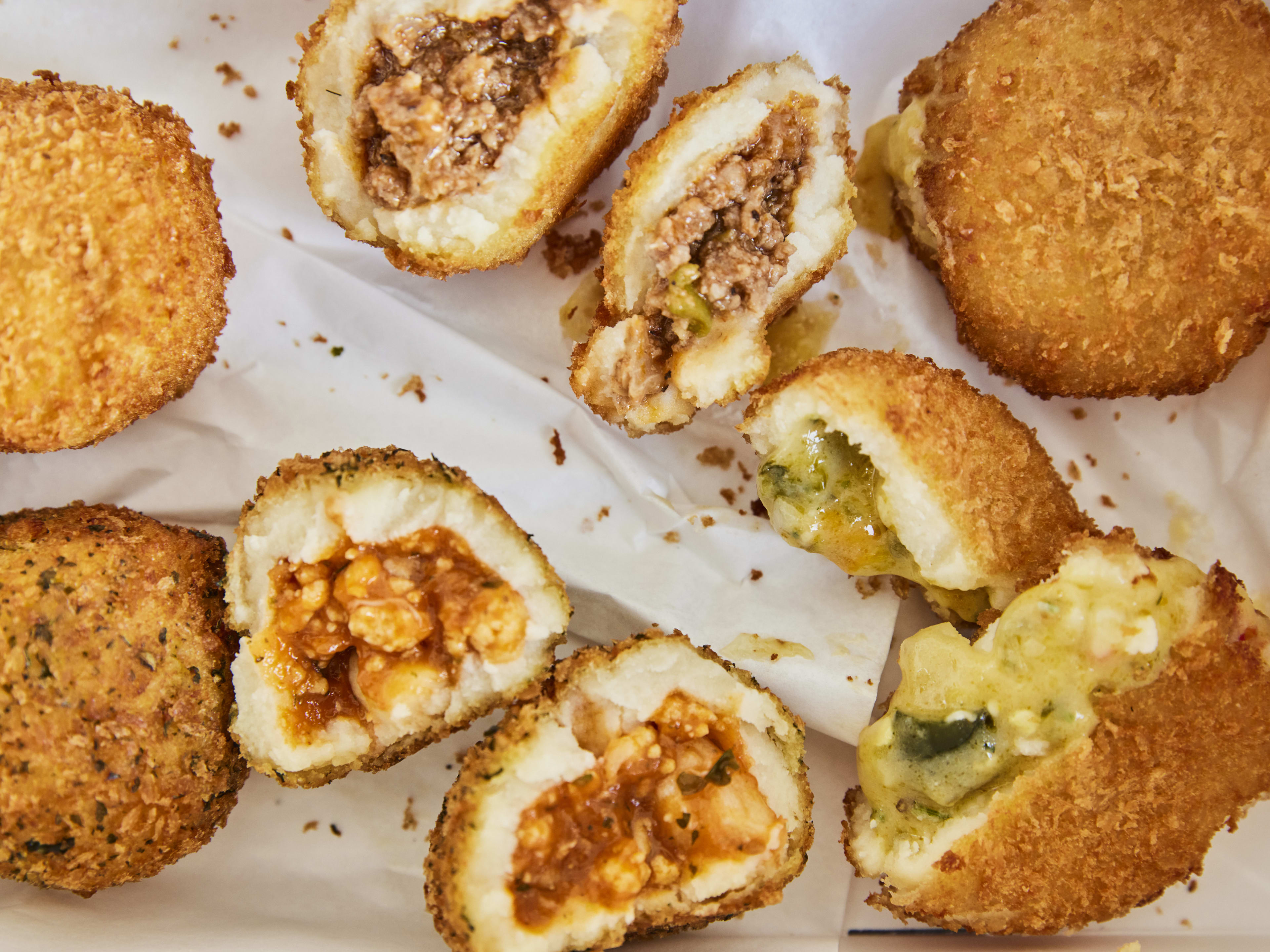 A mix of various potato balls from Porto's Bakery.