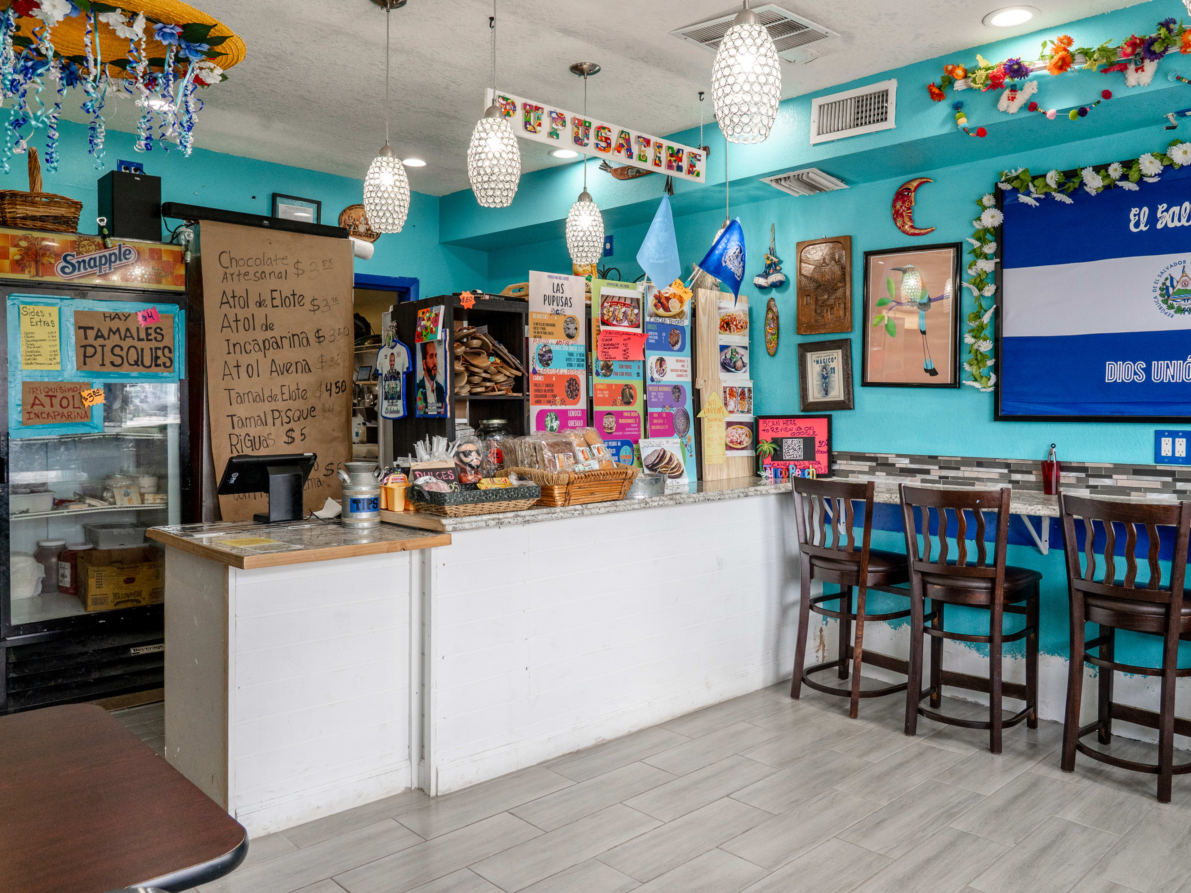 colorful interior with ordering counter and barstool seating