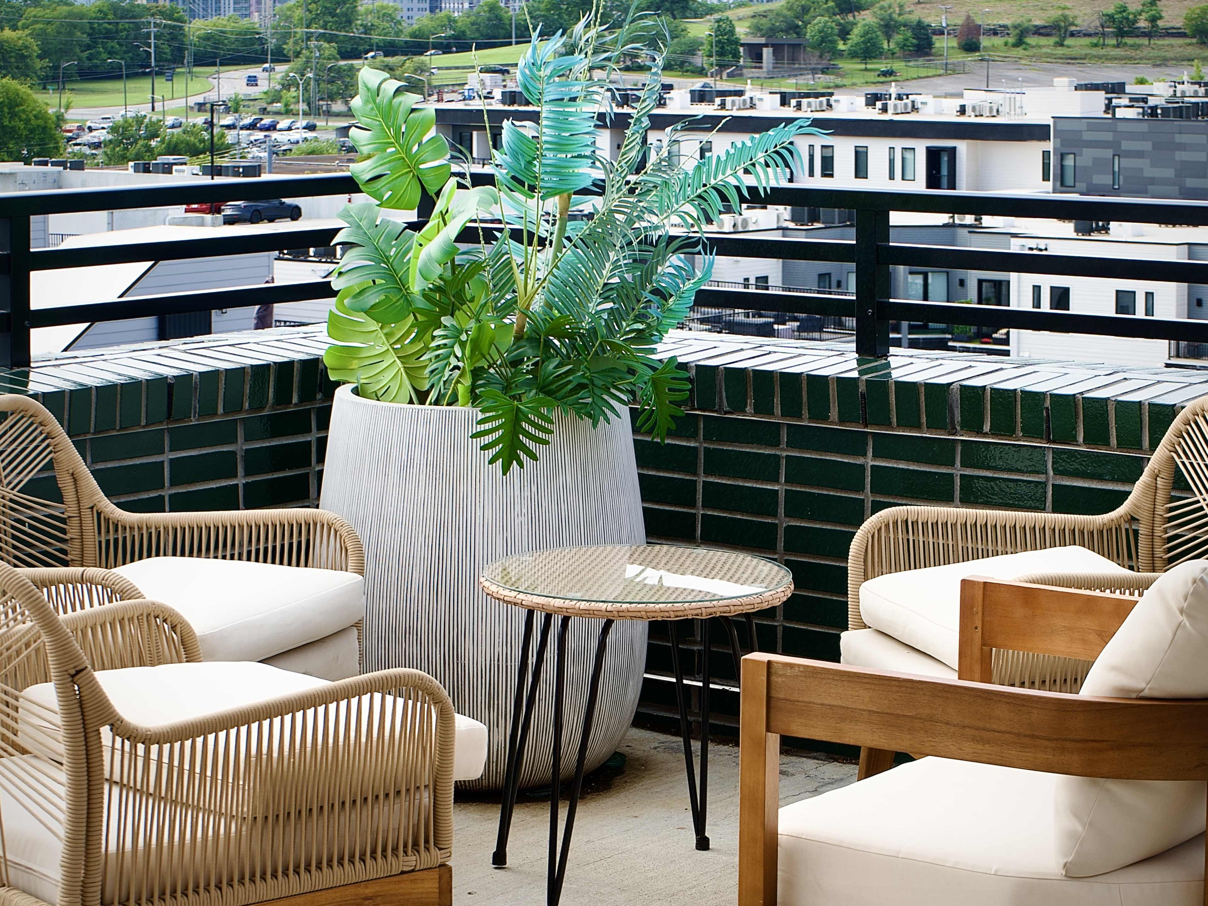 rooftop with chairs and plants