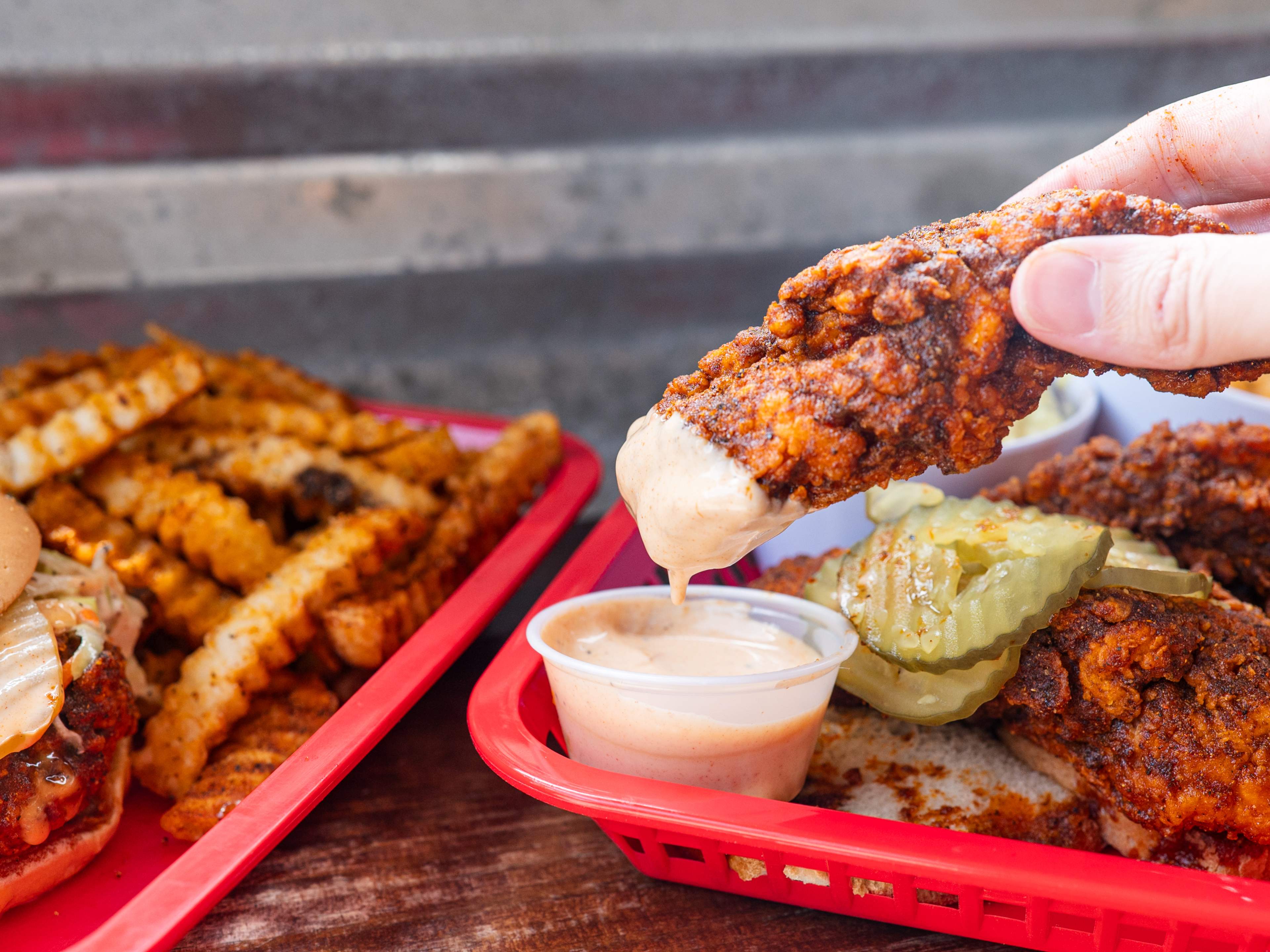 A spread of hot chicken and sides from Red's.