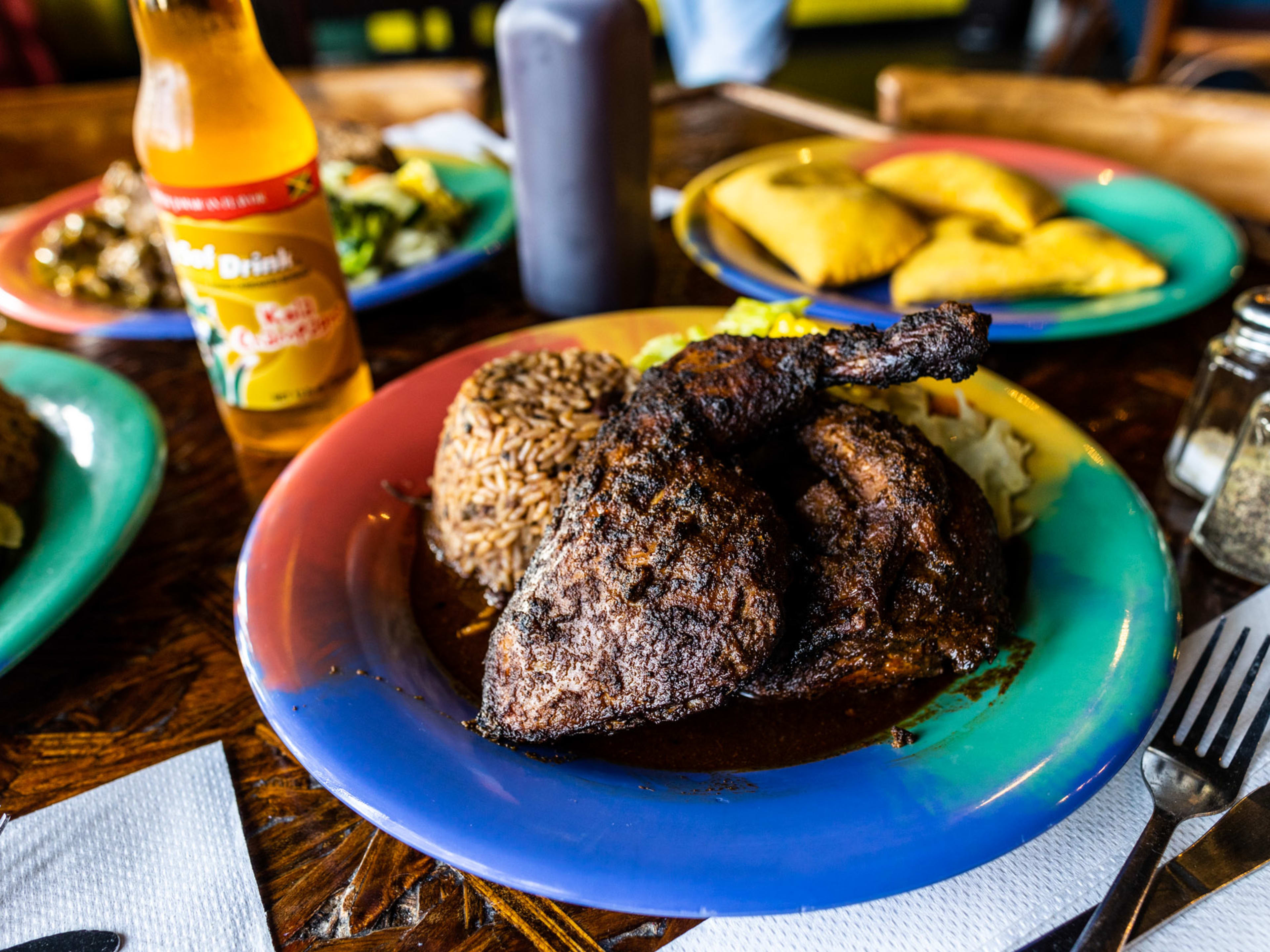 A colorful plate of jerk chicken from Reggae Hut.