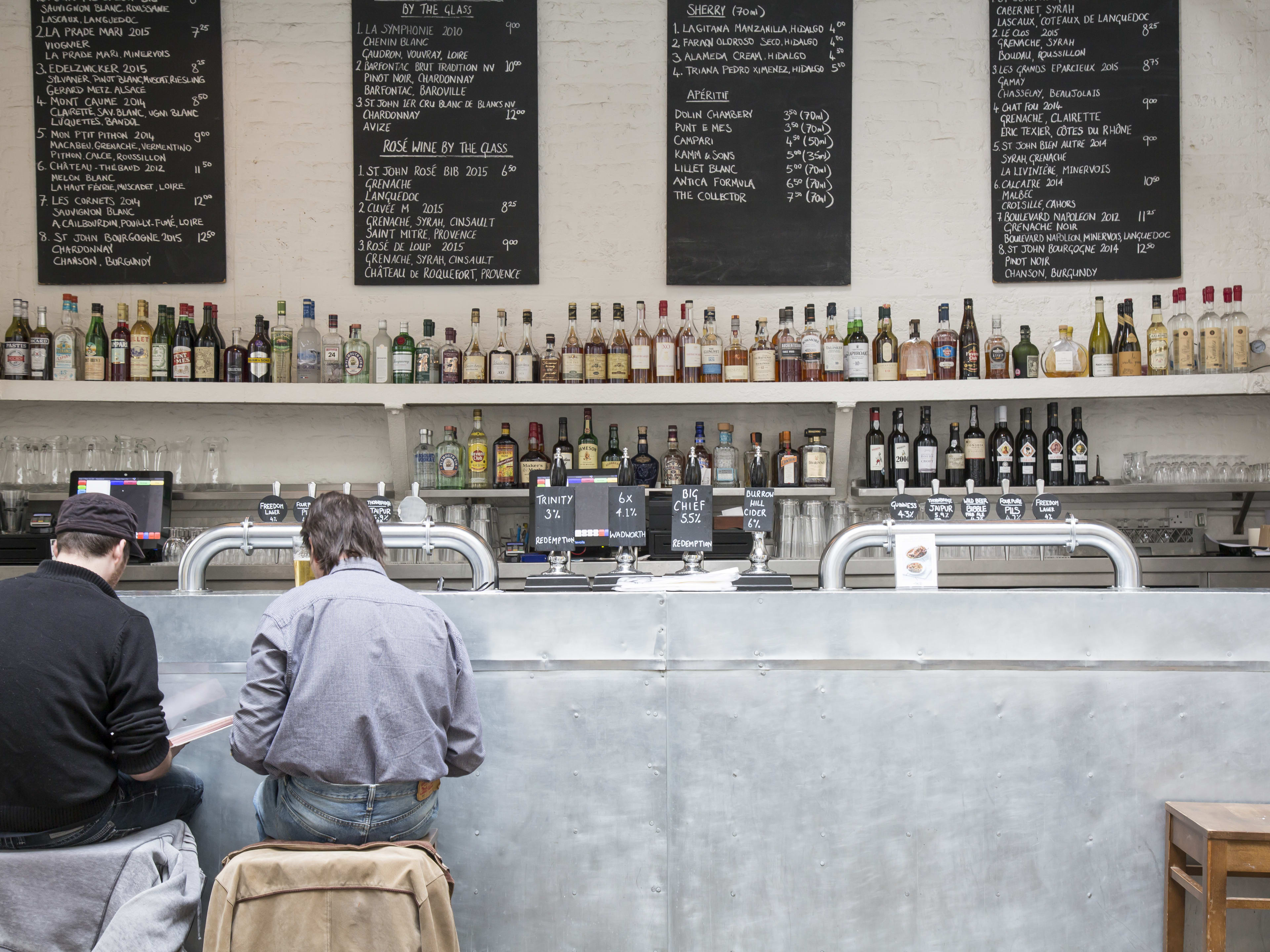 Two people sit at the bar at St. John.