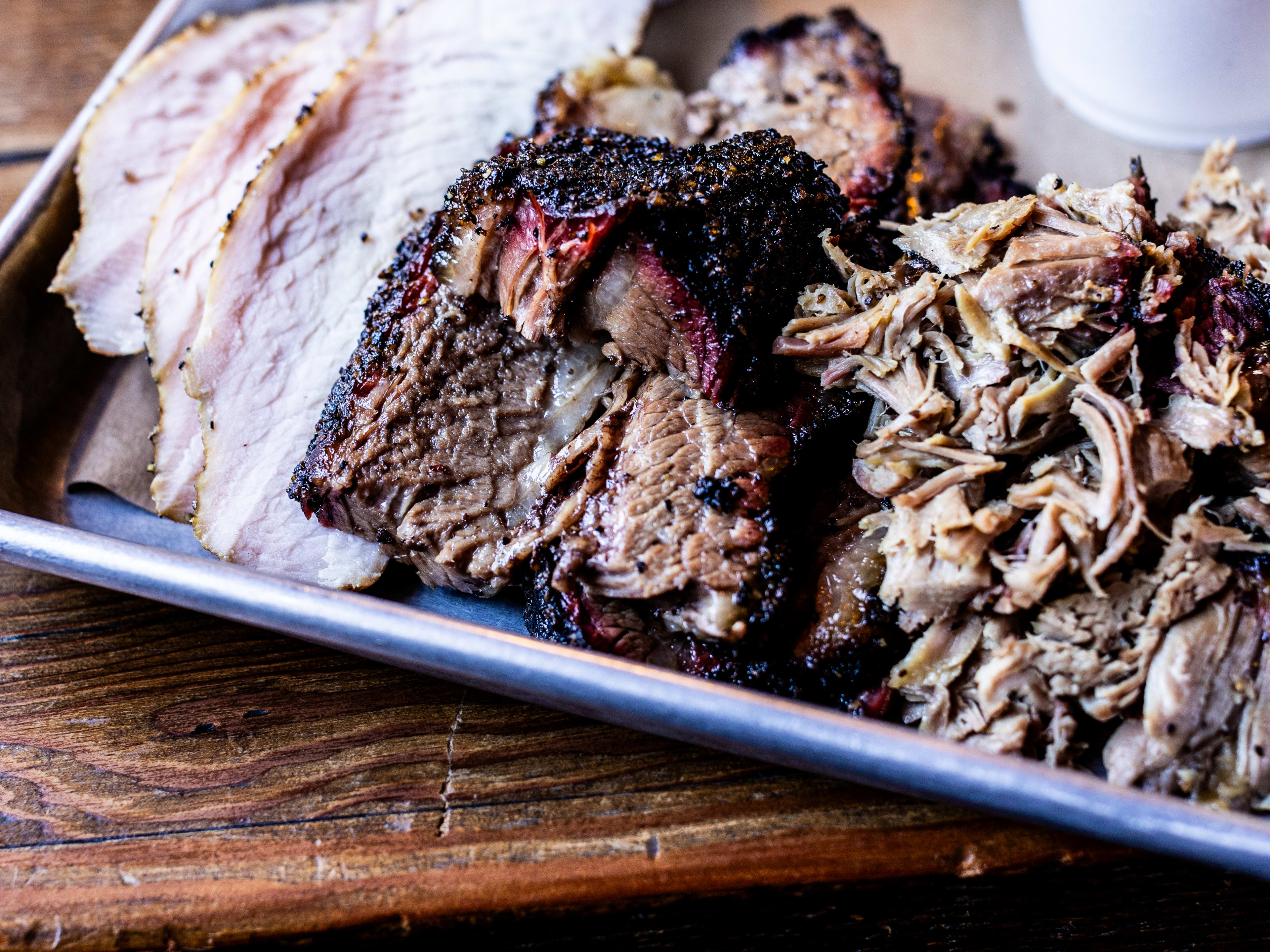 tray of barbecue with turkey, brisket and pulled pork