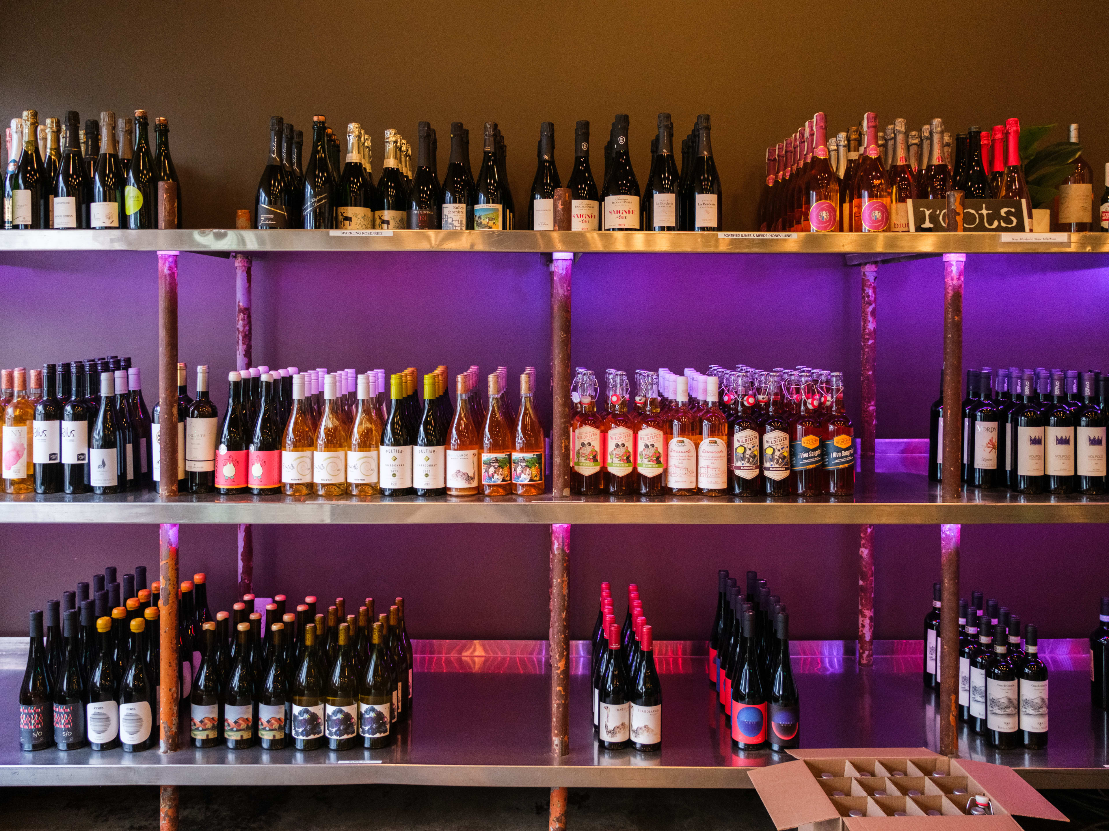 The bottle selection for purchase at Roots Wine Bar.