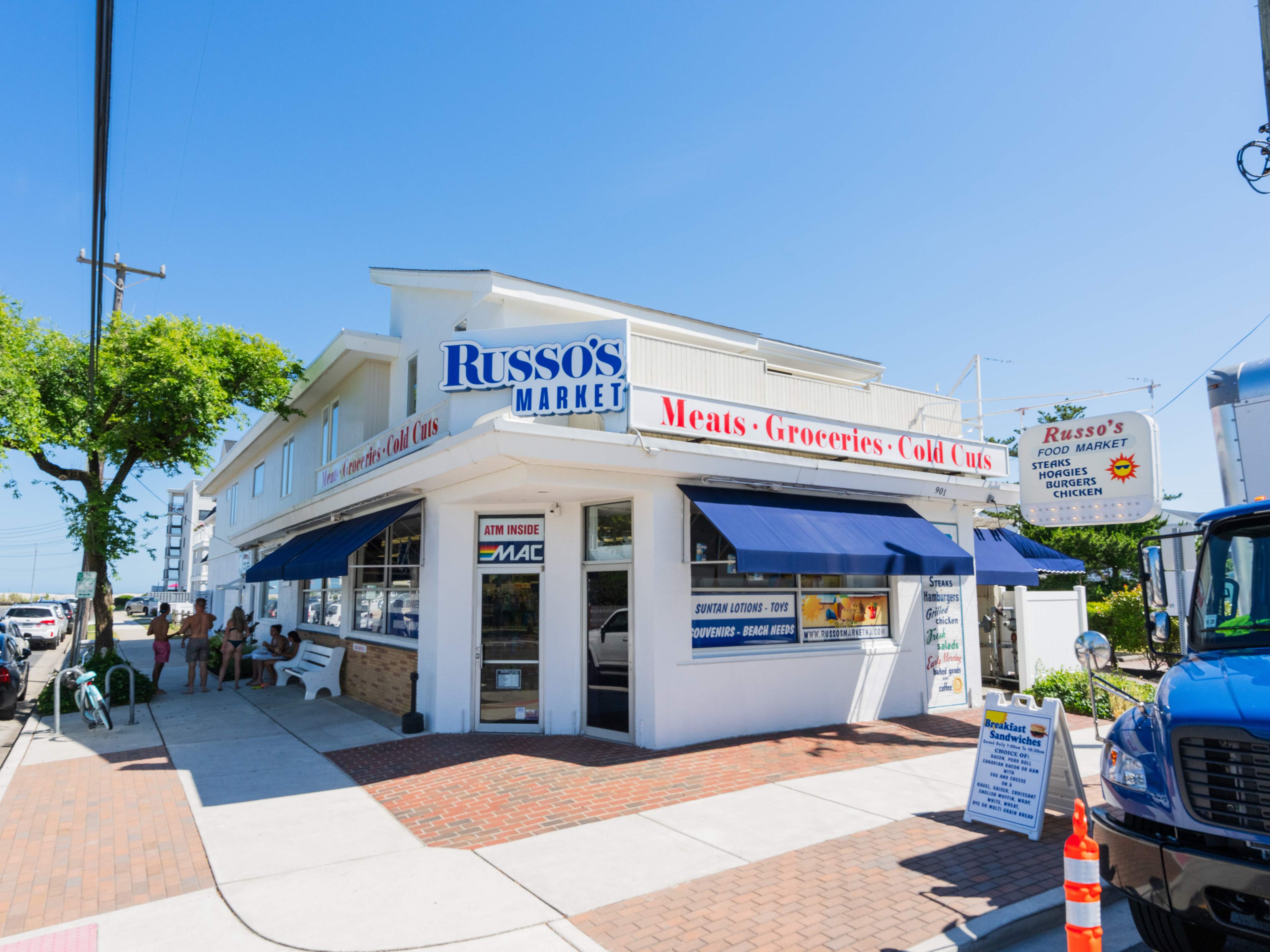 Clean, white exterior with Russo's signage.