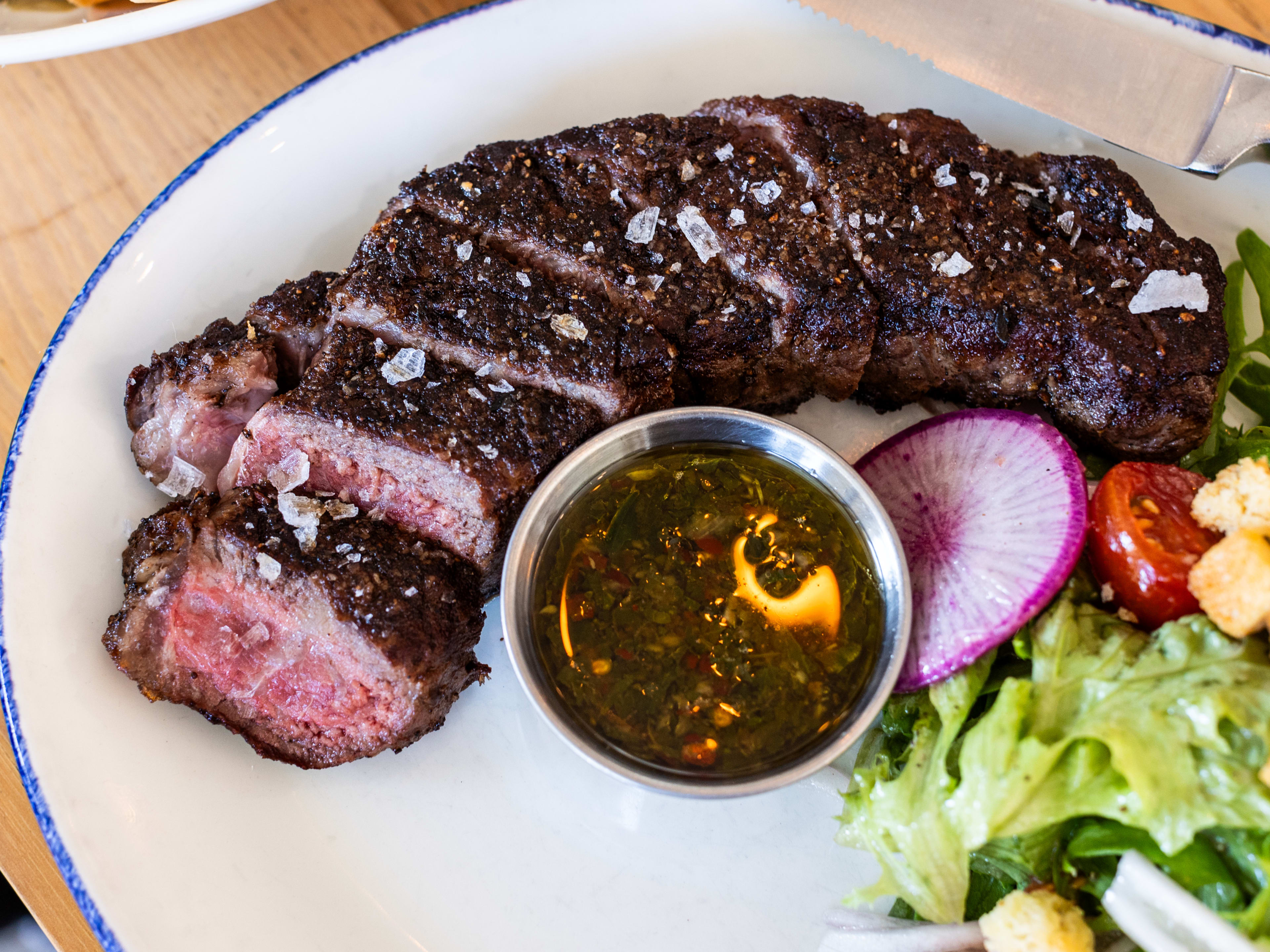 a steak with chimichurri