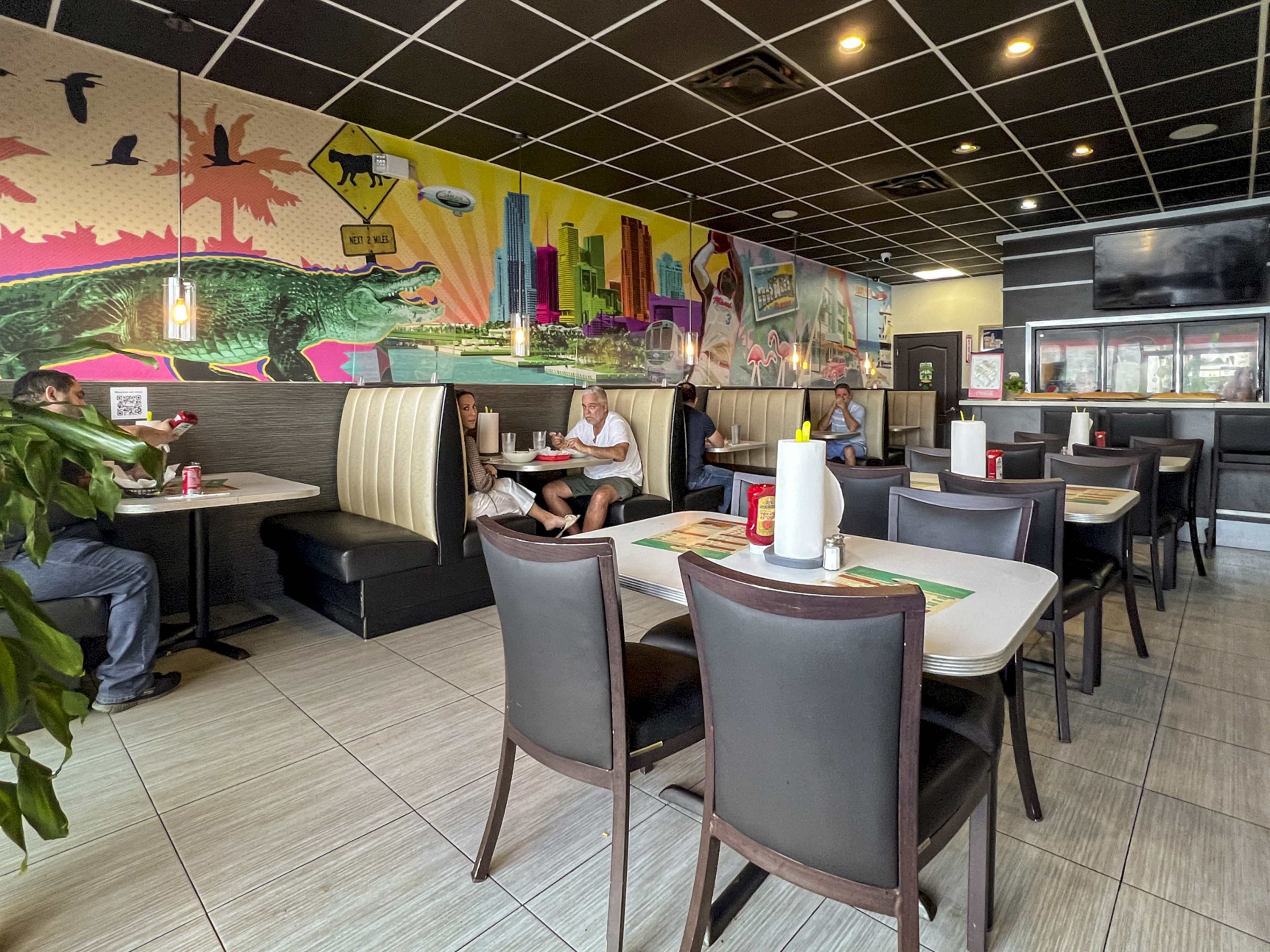 casual restaurant interior with colorful mural