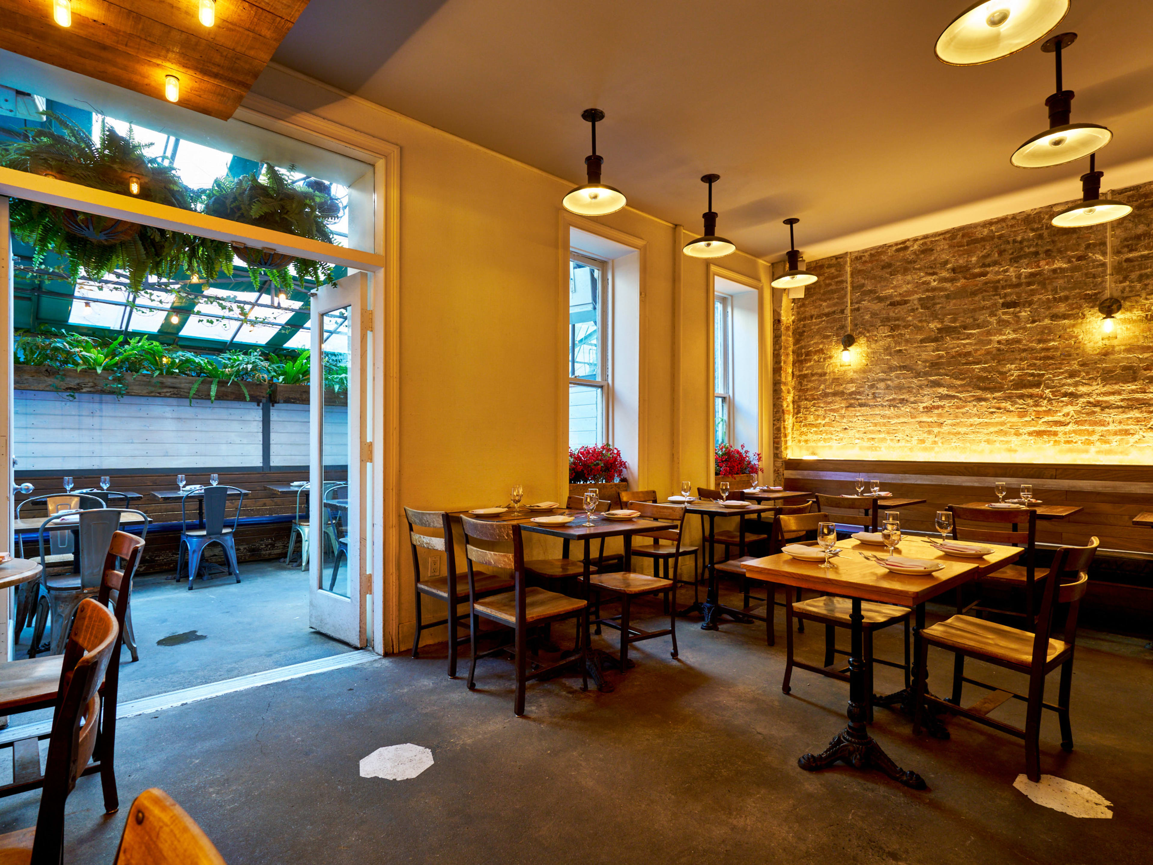 a restaurant dining room opening out into a patio