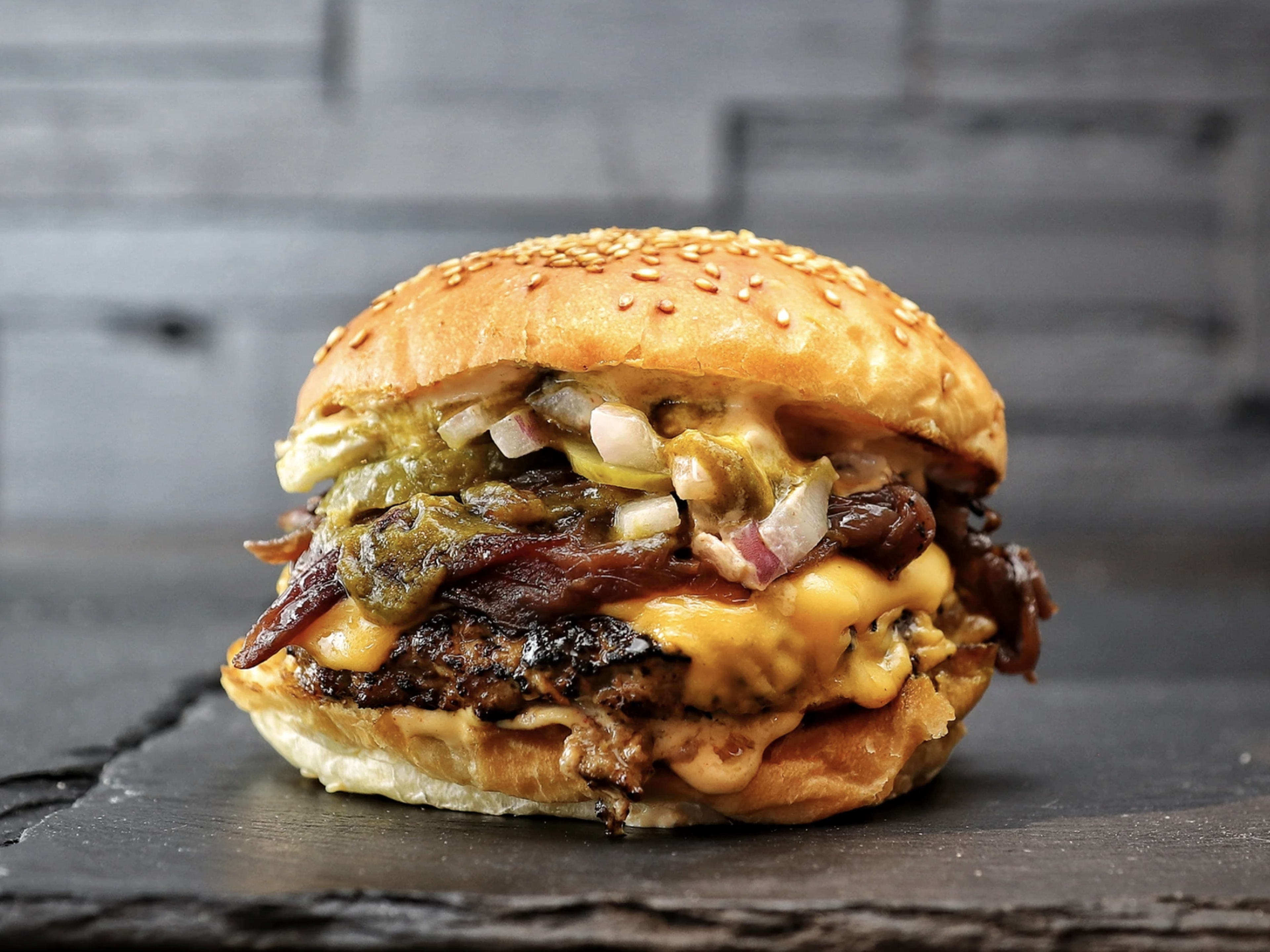 The double patty smashburger with caramelised onion and cheese from Buk.