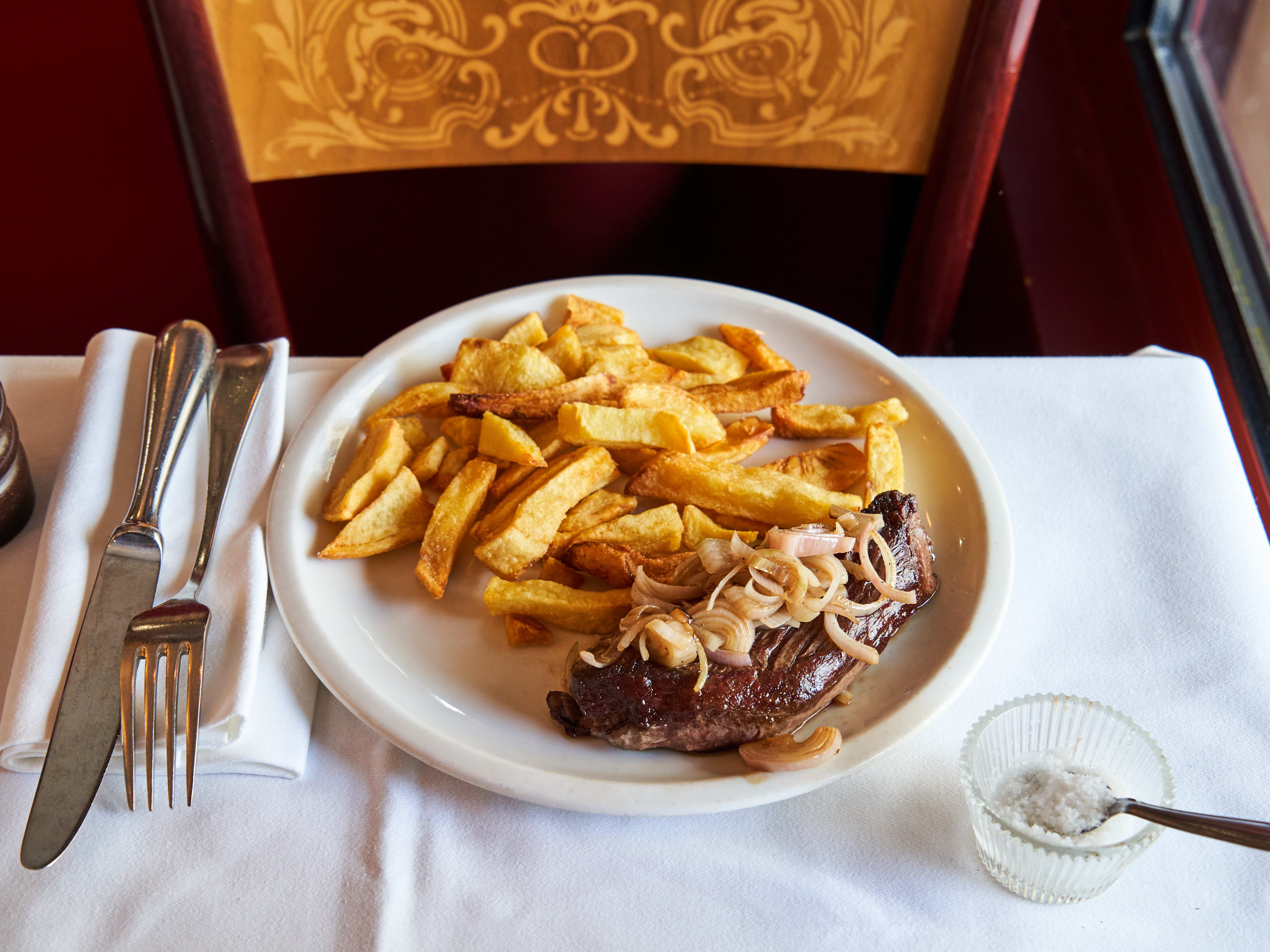 Bavette steak frites on white tableware at Le Severo