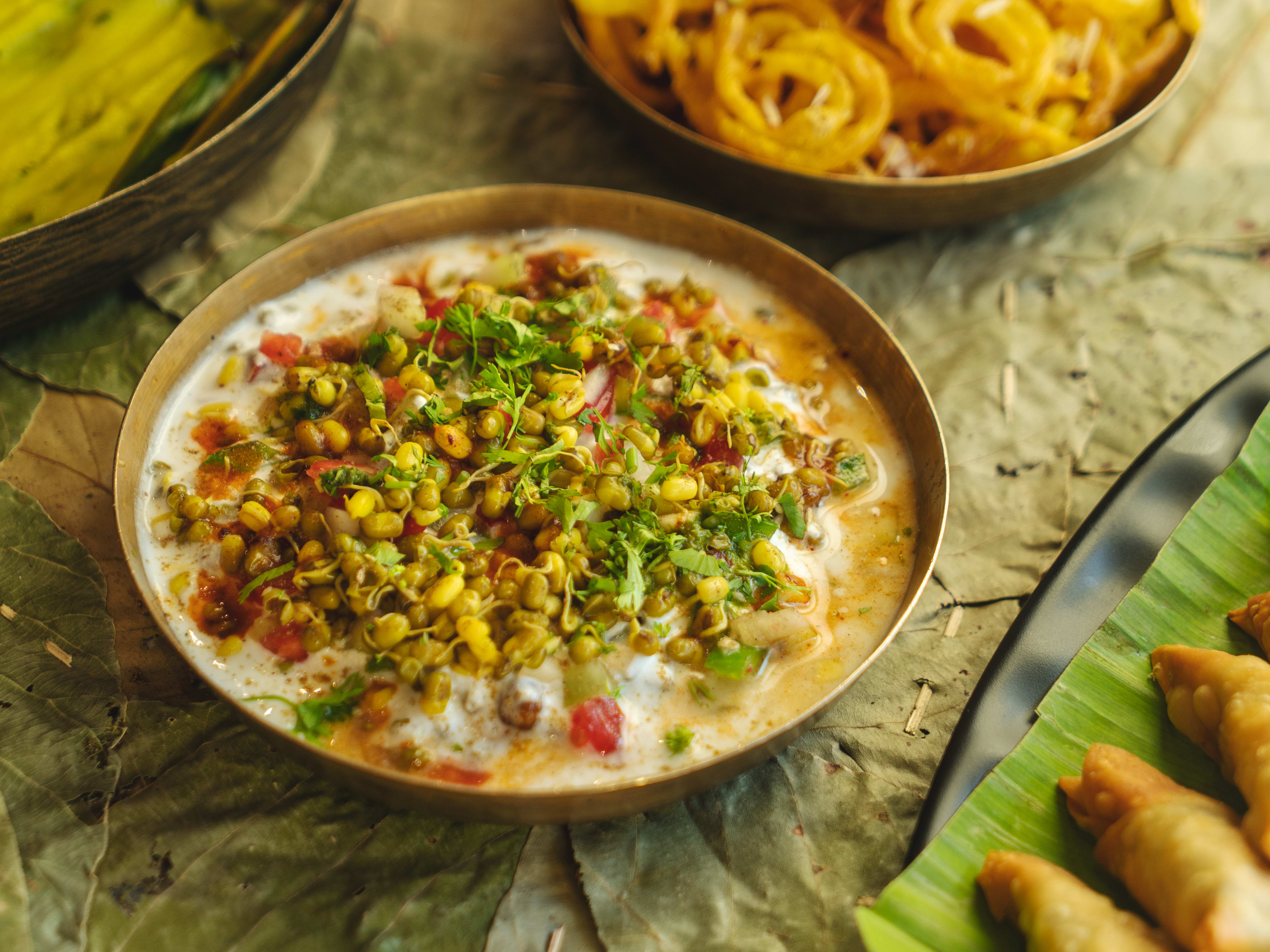 Vitamin Bhel with plate of samosas at Soam