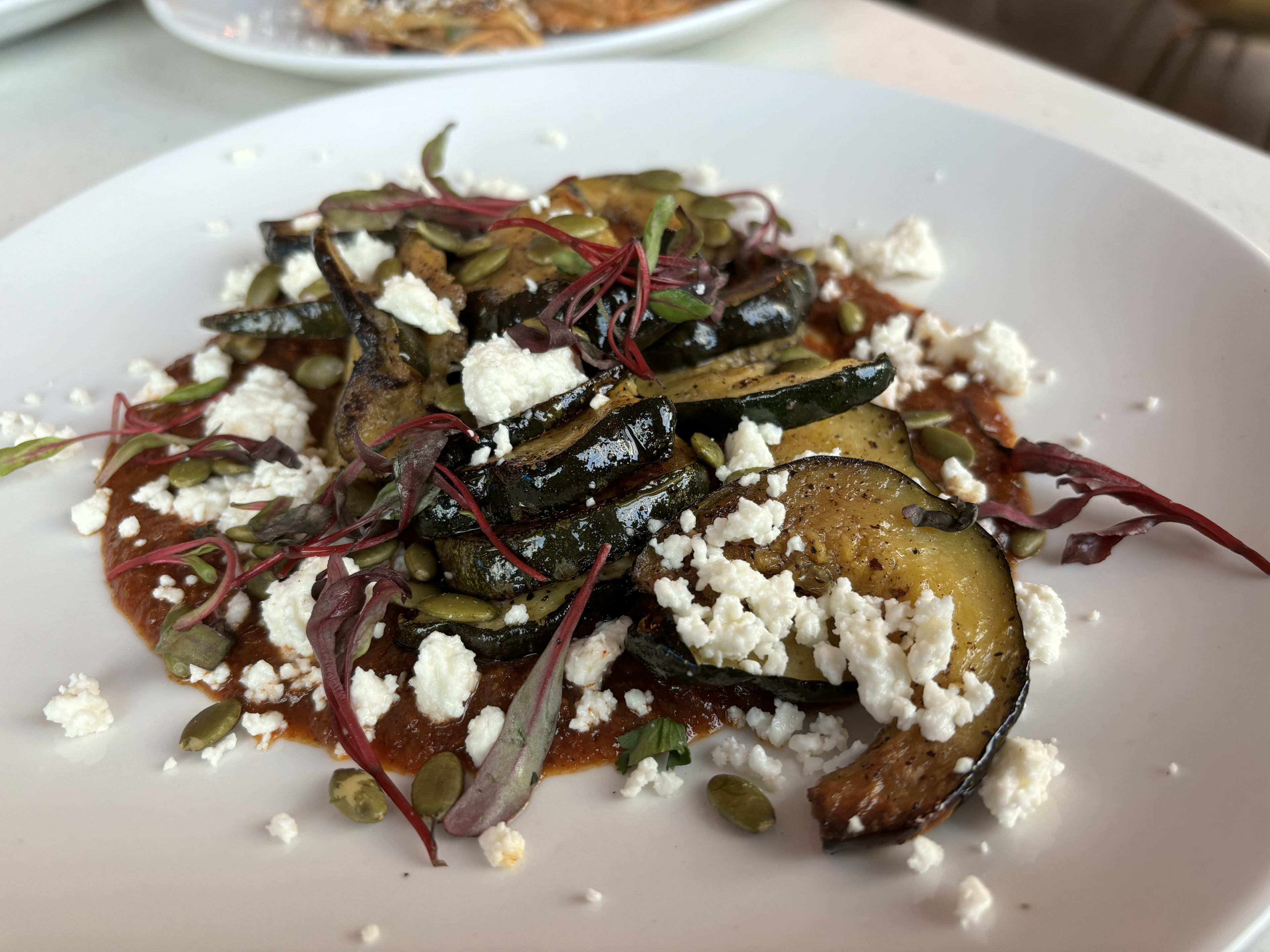 Sofrito squash with crumbles of queso fresco.