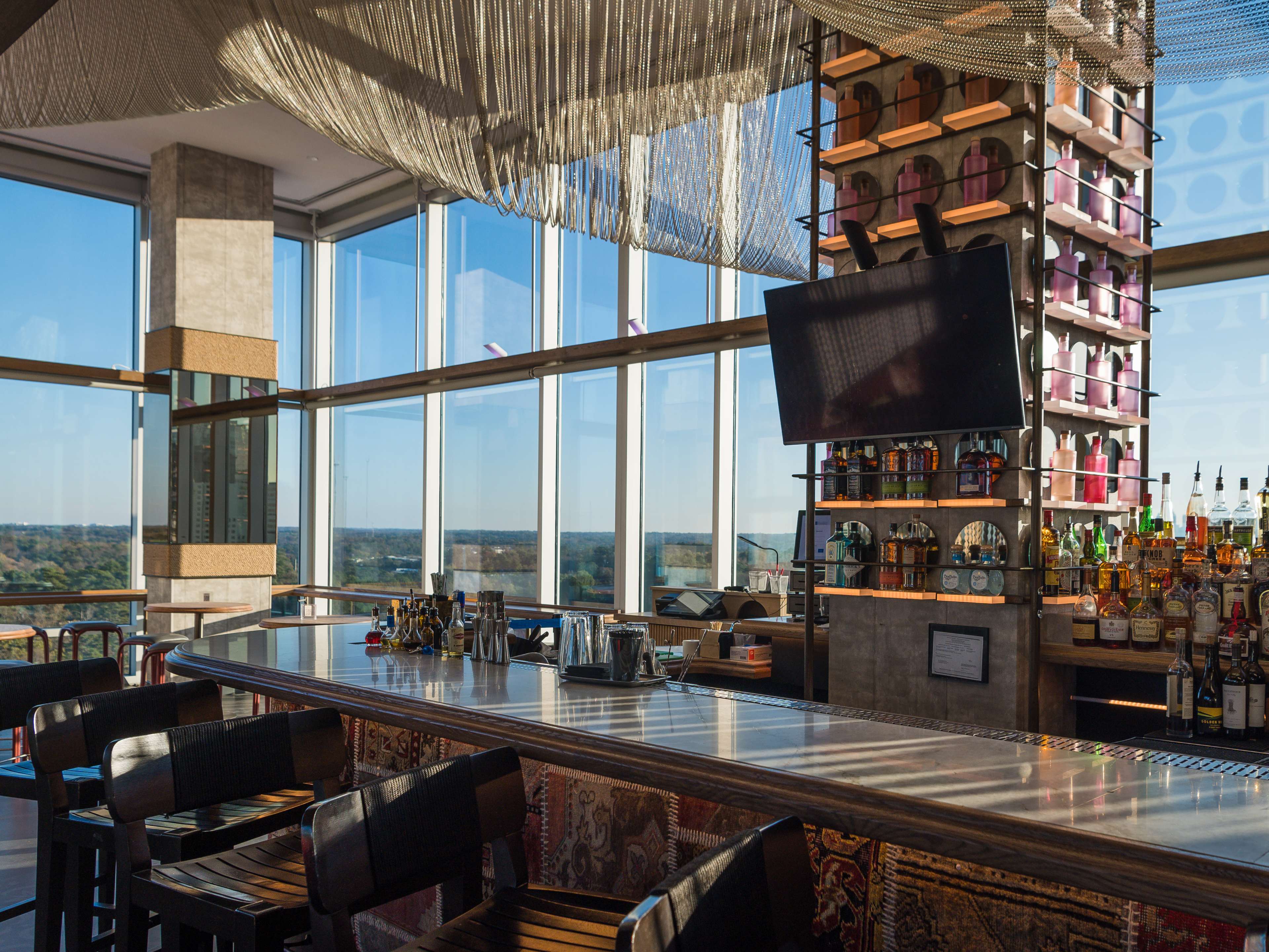 A bar with windows behind it.