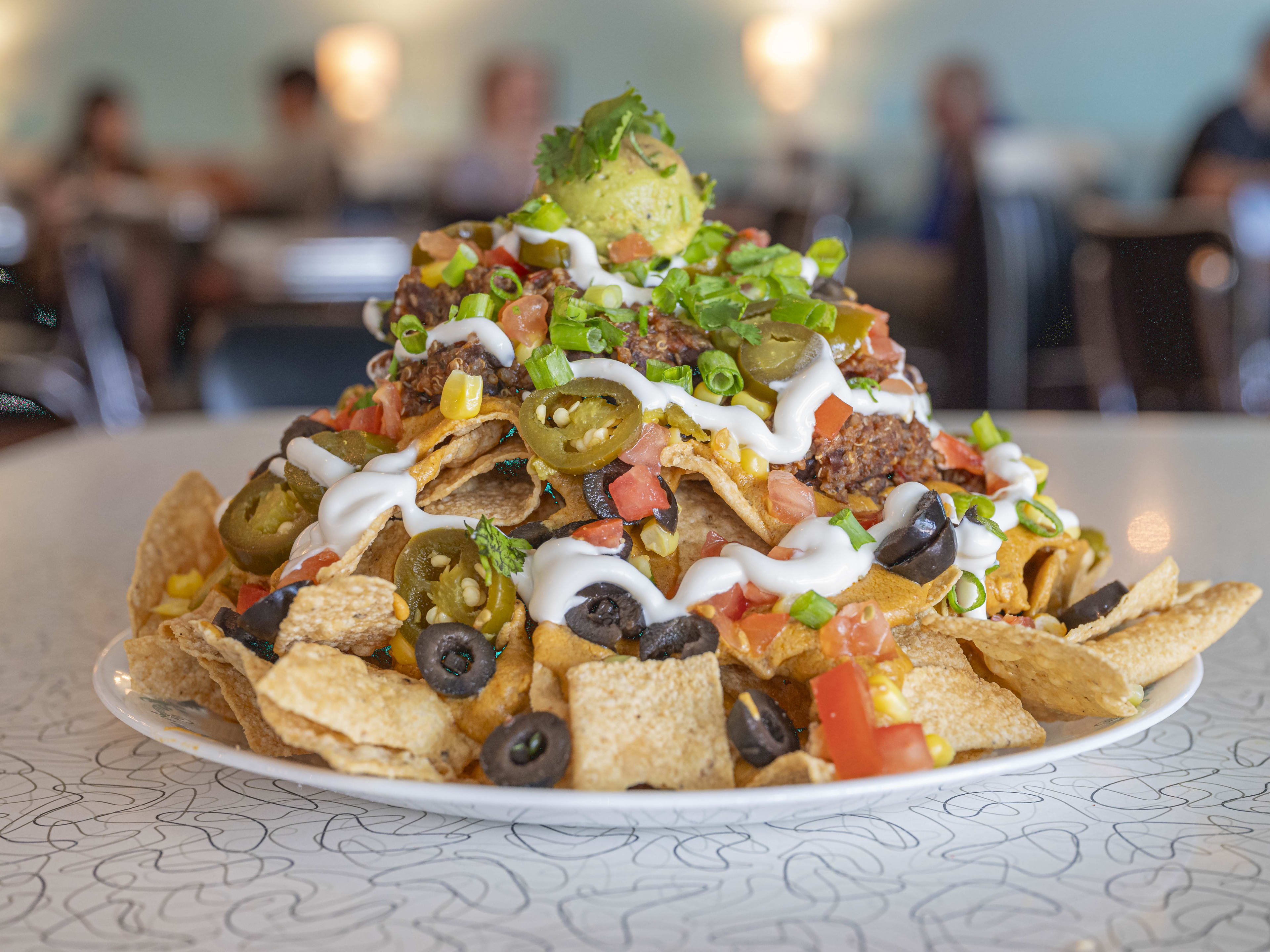 A heaping plate of vegan nachos at Spiral Diner & Bakery