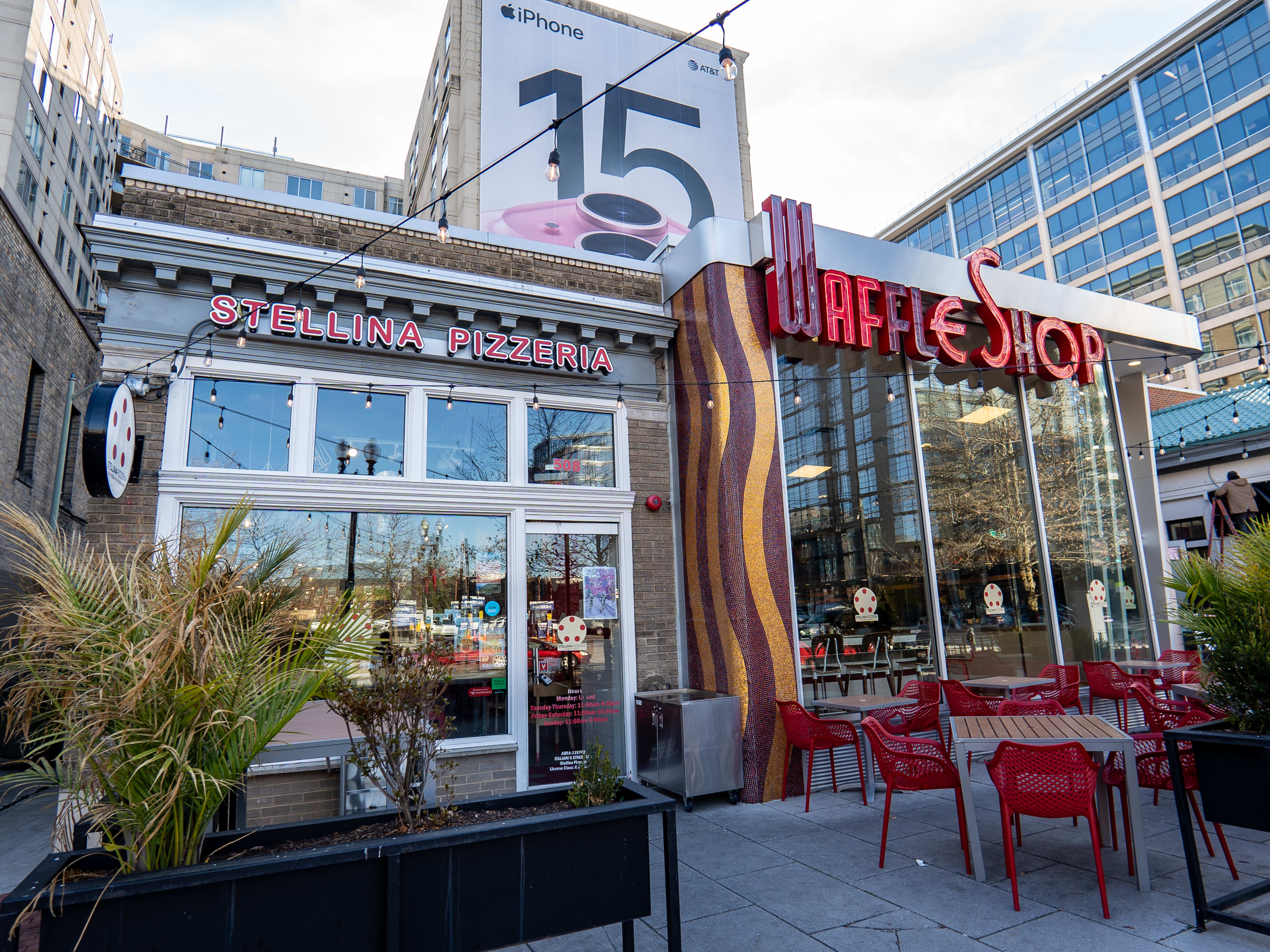 Split exterior of Stellina Pizzeria and Waffle Shop with small front patio