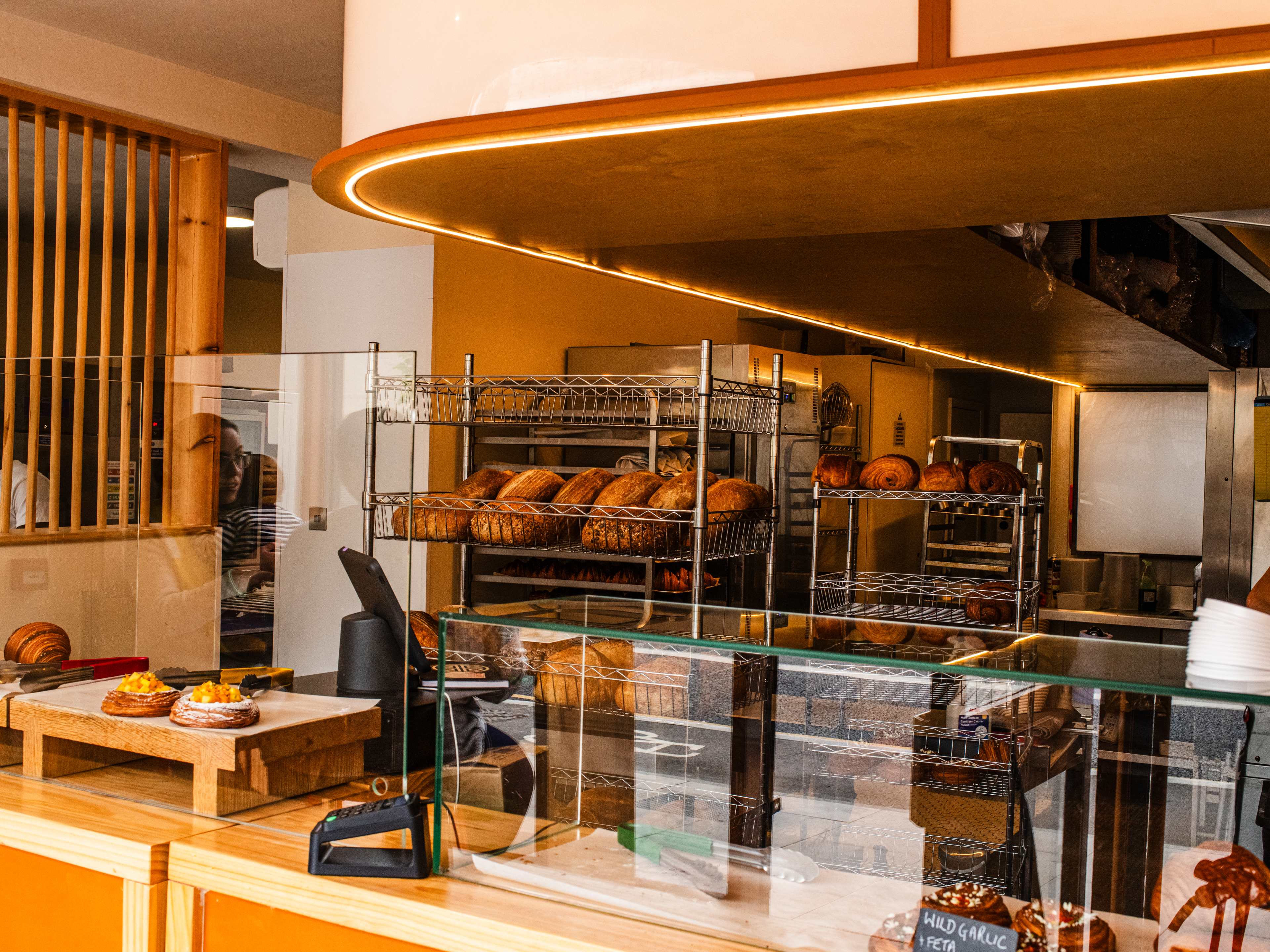 The pastry case and kitchen at Suba Bakery.