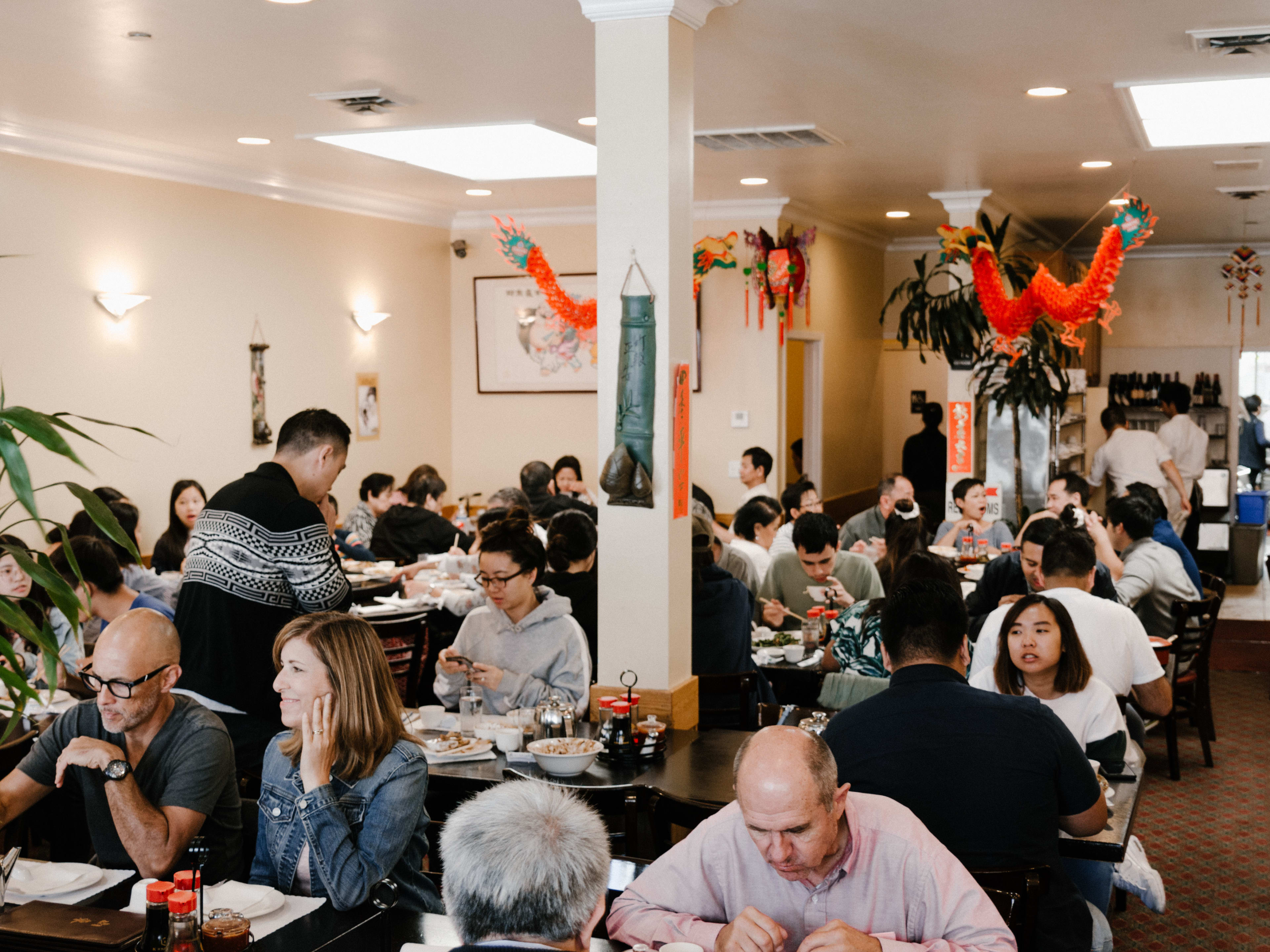 packed interior of restaurant, diners at every table