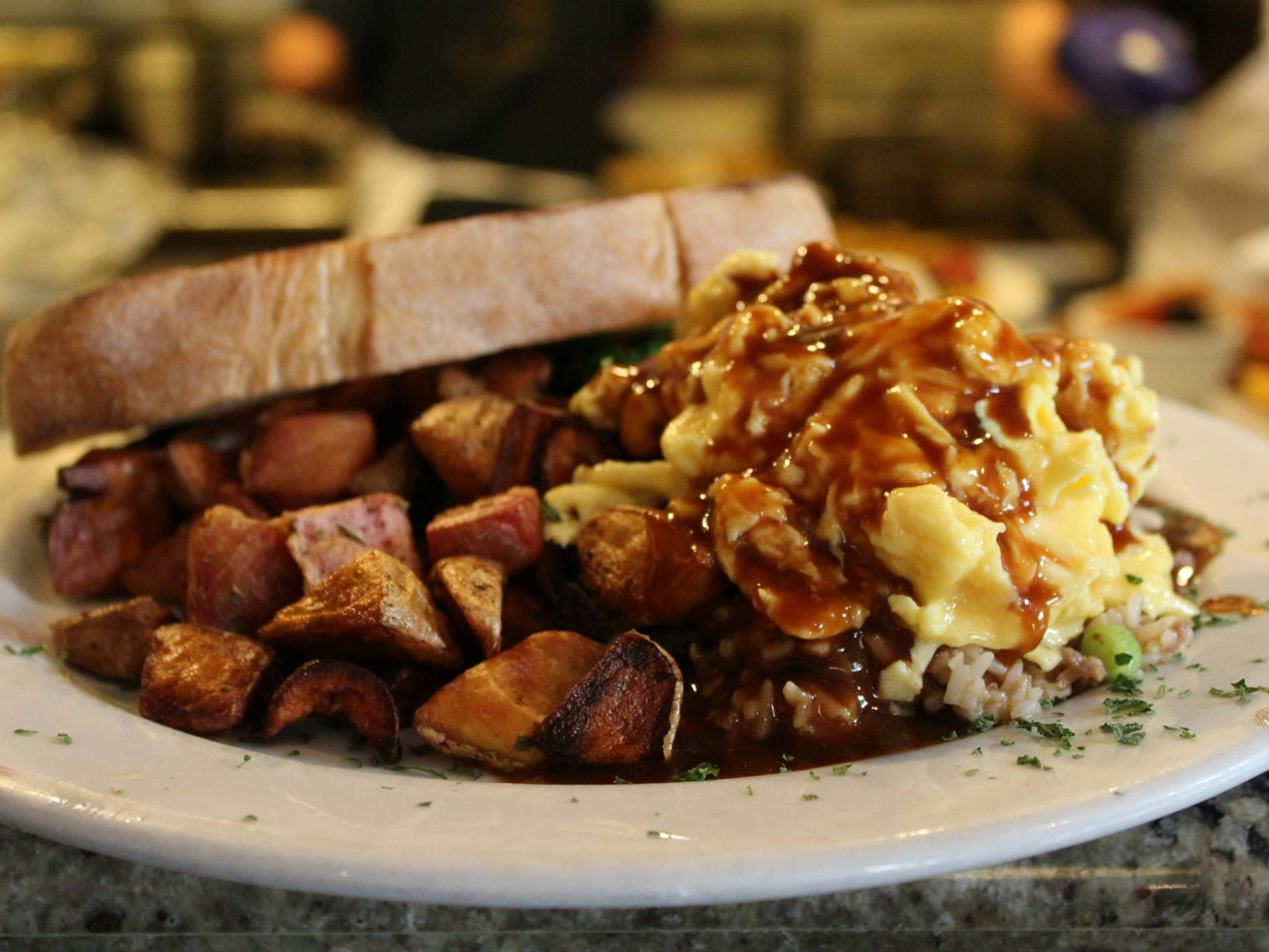 A plate of potatoes and eggs at Sweet Maple