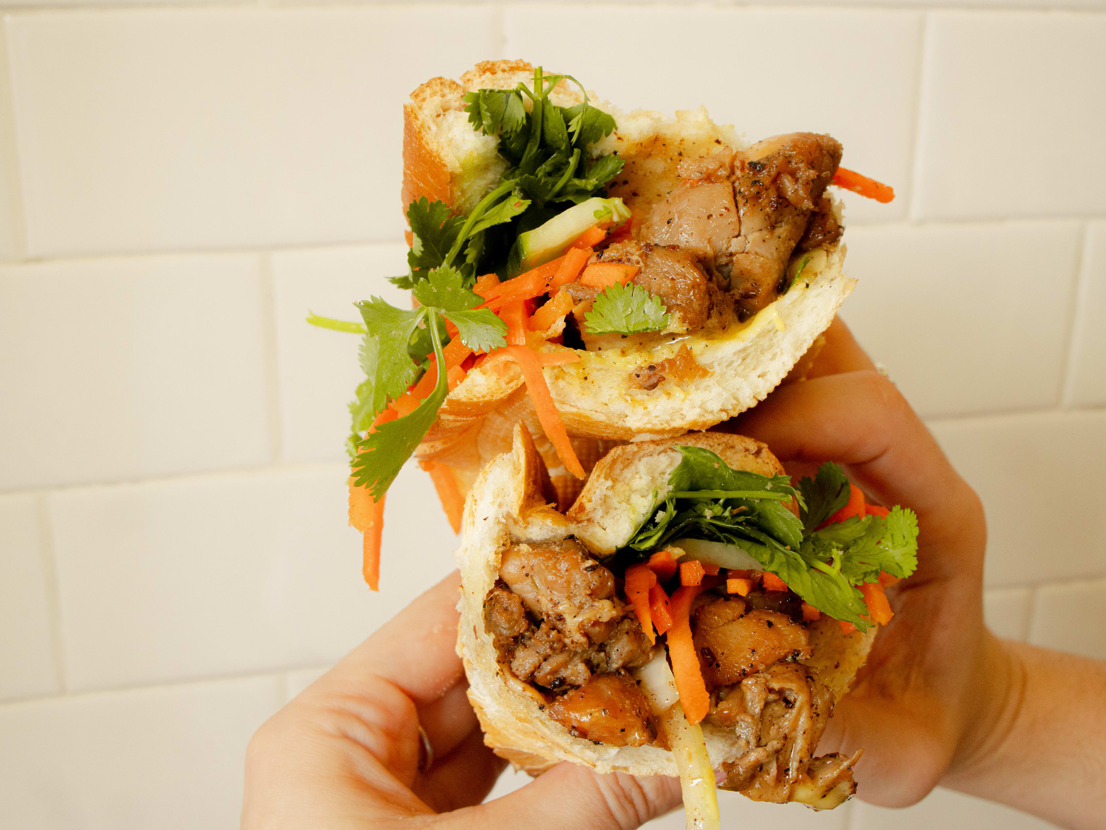 cross section of banh mi with meat and veg