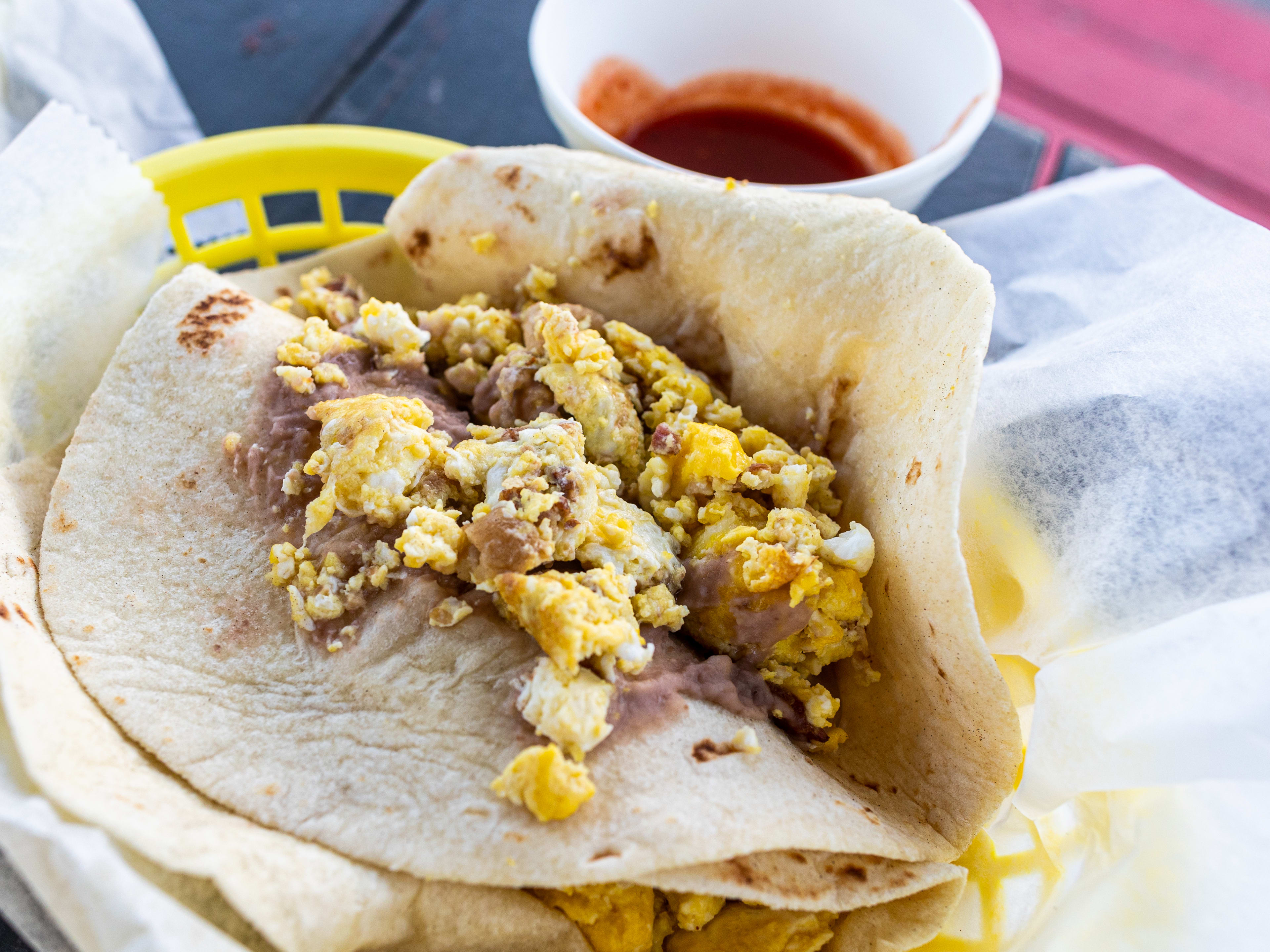 a bacon and egg breakfast taco from Laredo Taqueria.