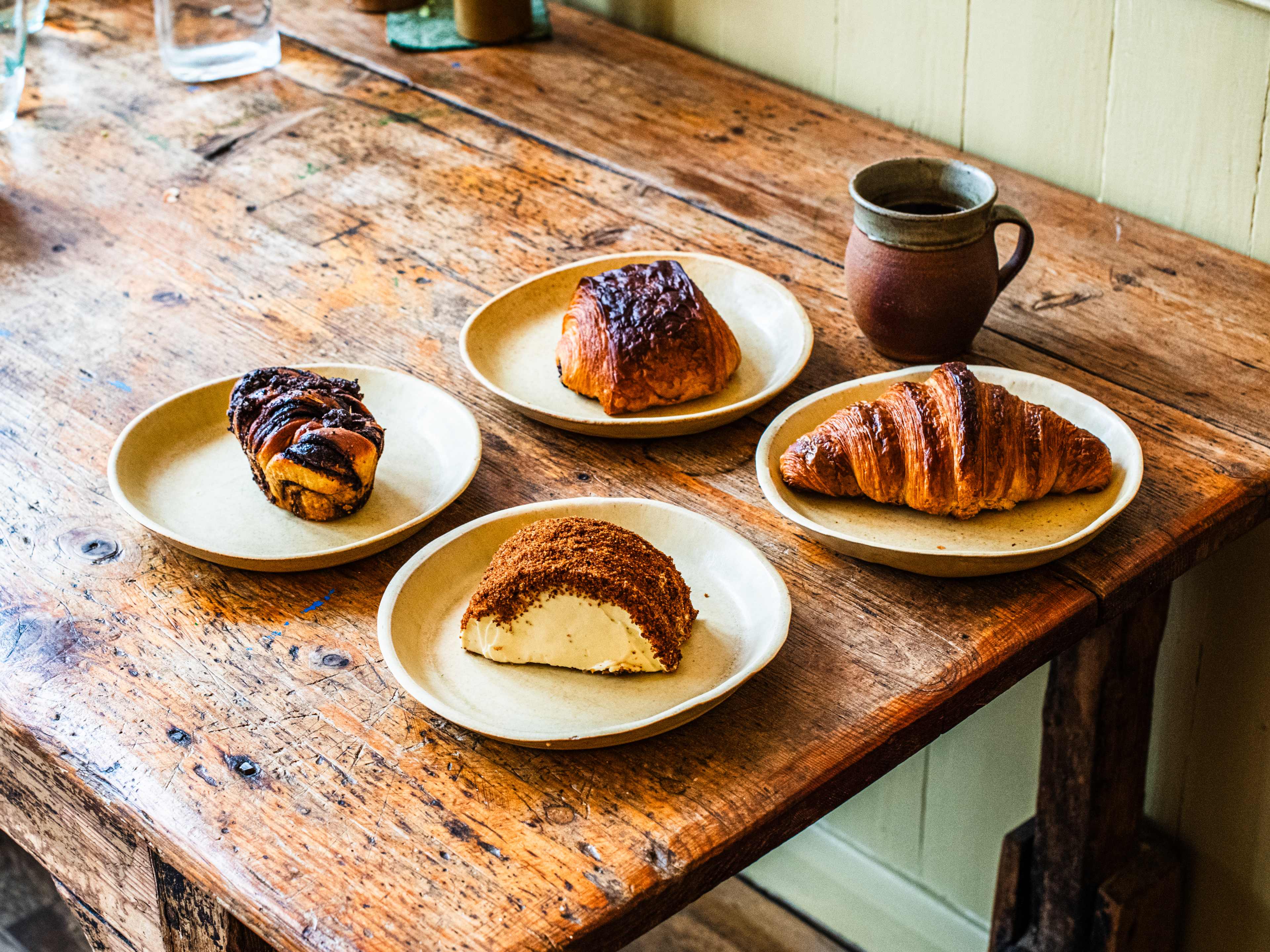 A spread of pastries from Tarn Bakery on a wooden table.