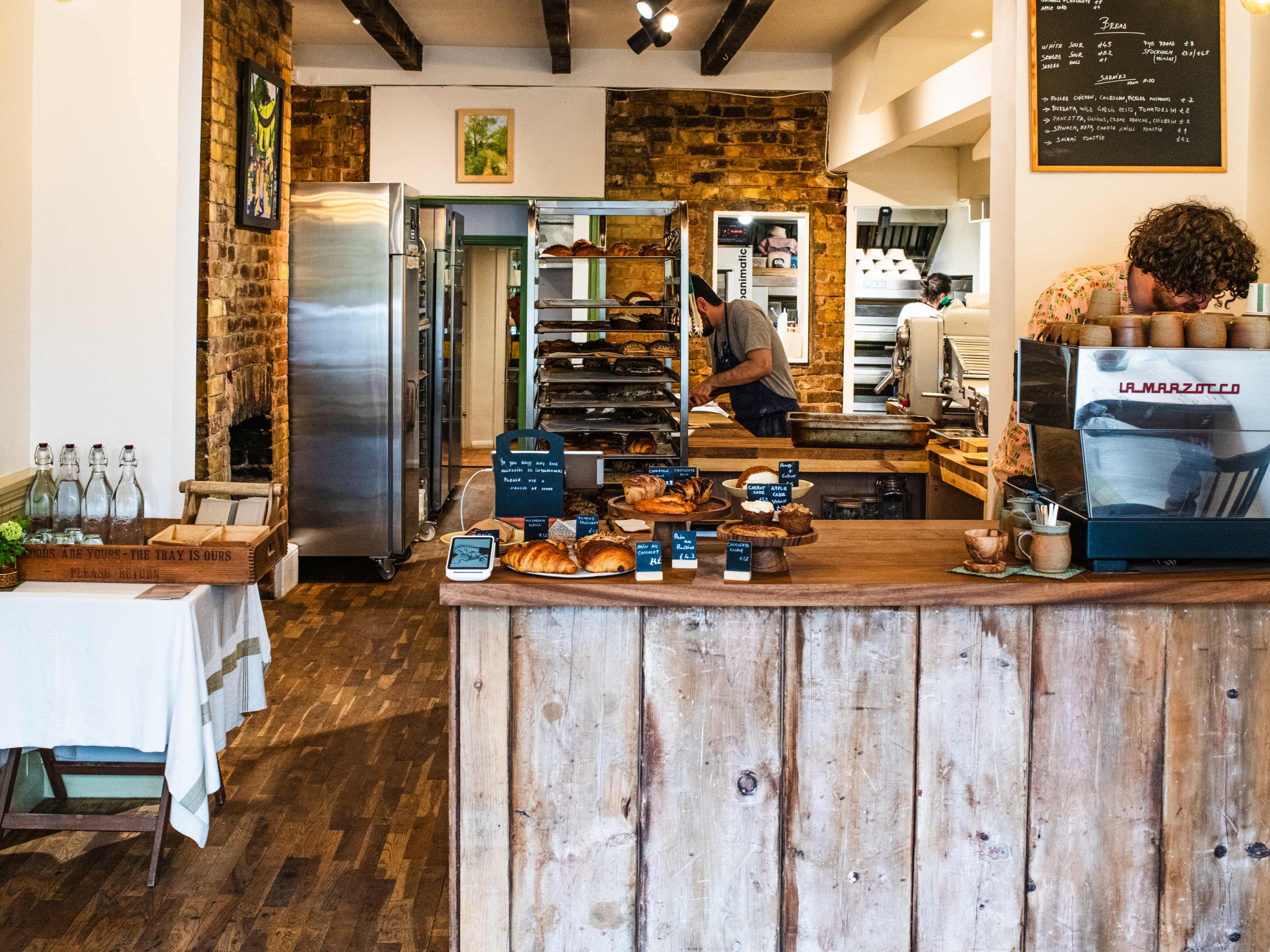 The order counter and kitchen at Tarn Bakery.