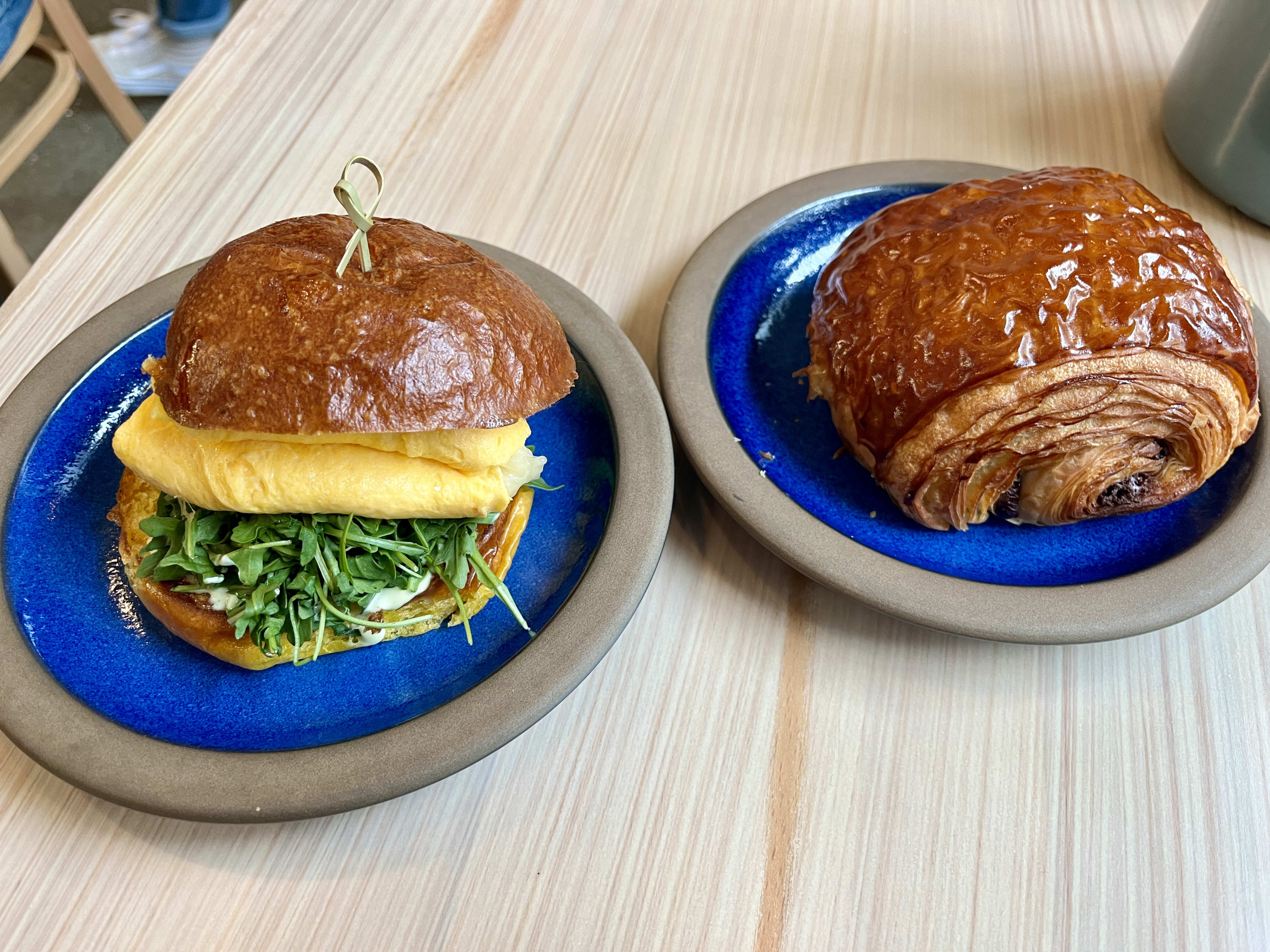 A pain au chocolat and a breakfast sandwich at Tartine Inner Sunset.