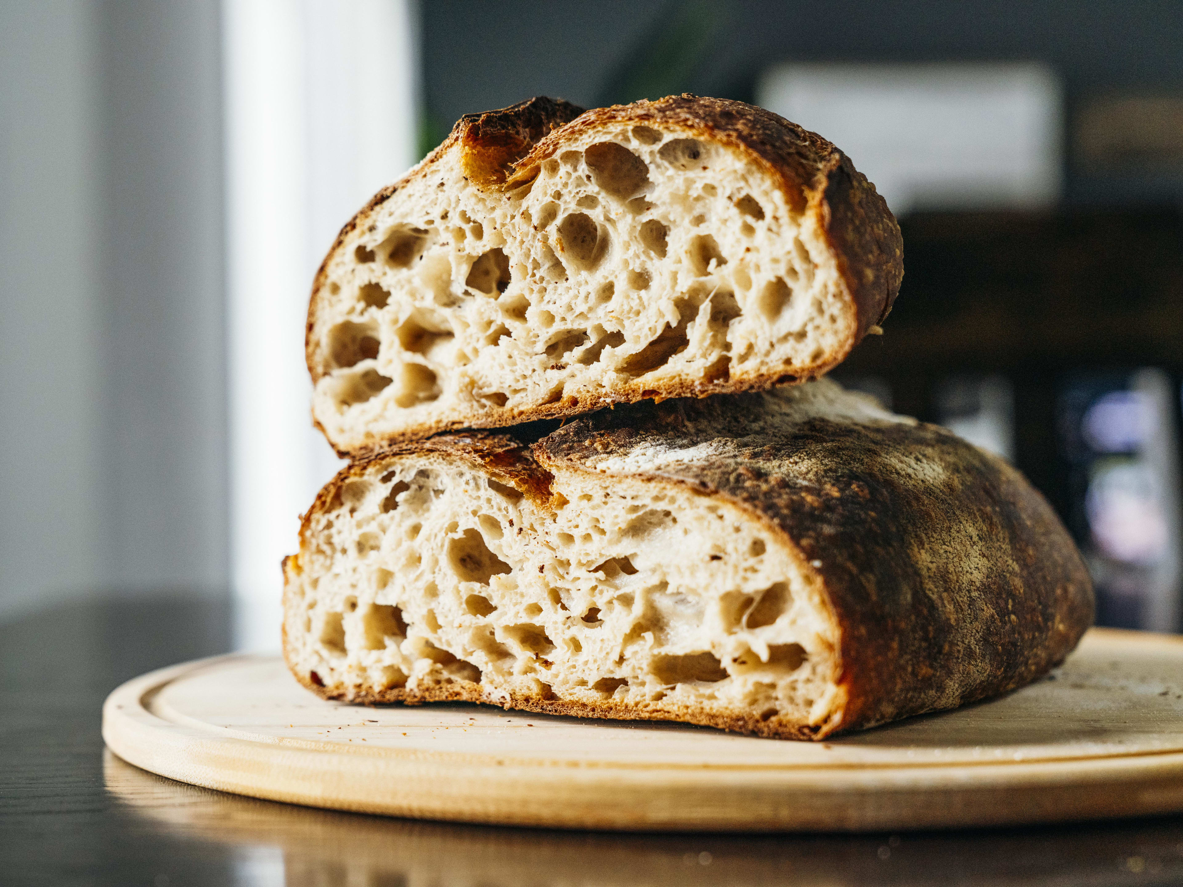 country loaf sliced in half to show airy crumb