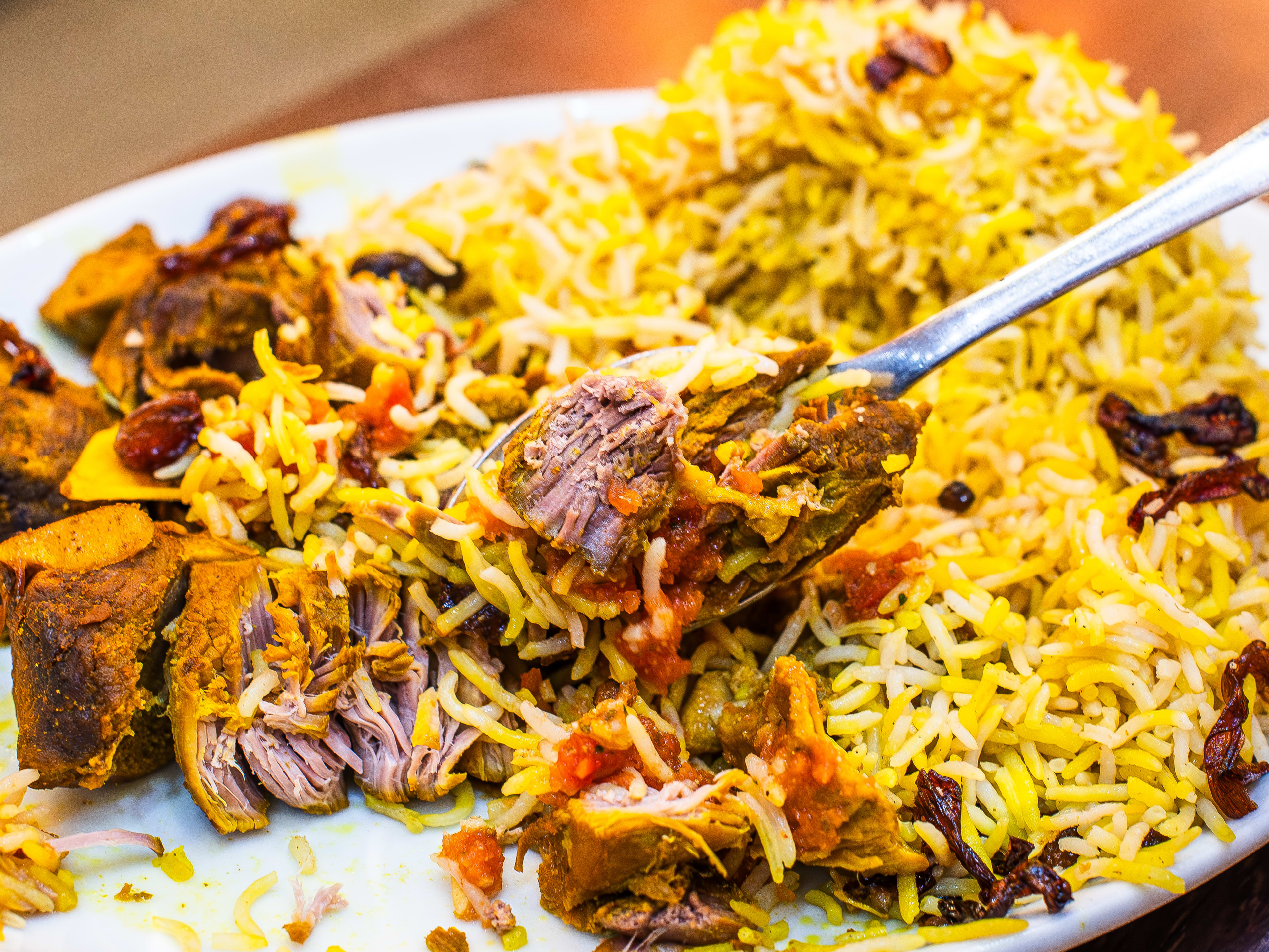 A forkful of lamb mandi from Taste of Yemen.