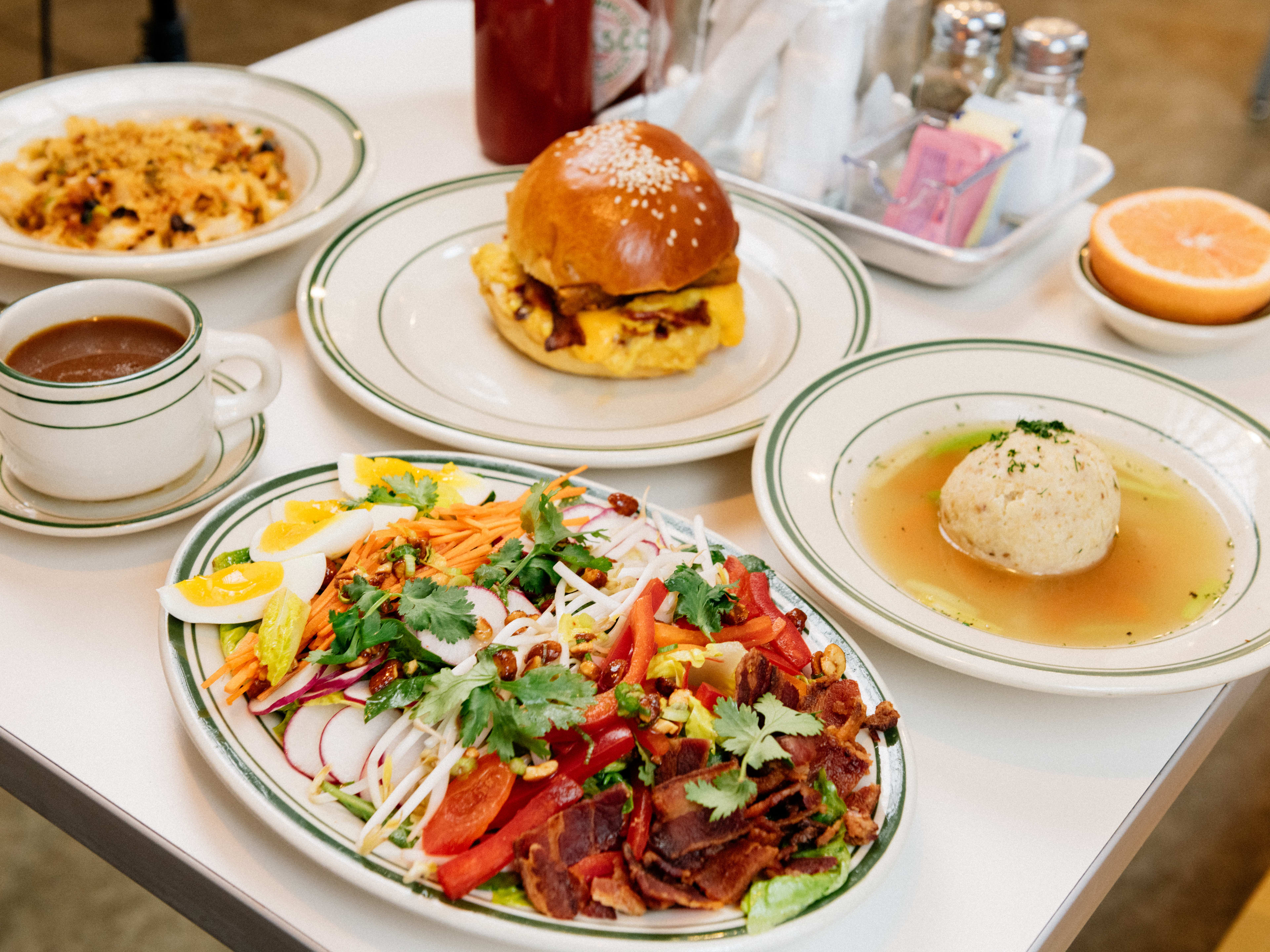 A spread of dishes including the Thai cobb salad from Golden Diner.