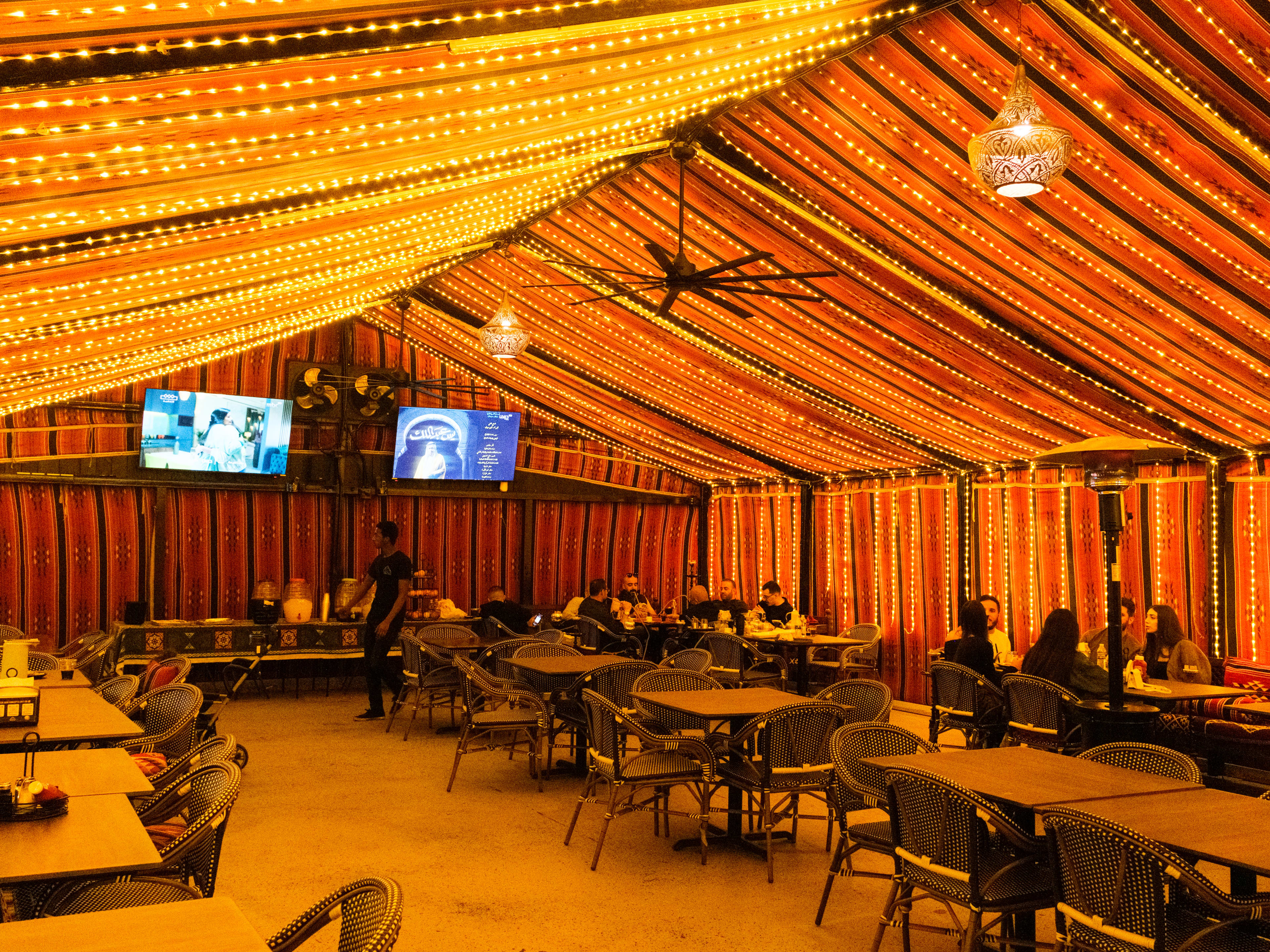 The covered tent covered with string lights at The Tent.