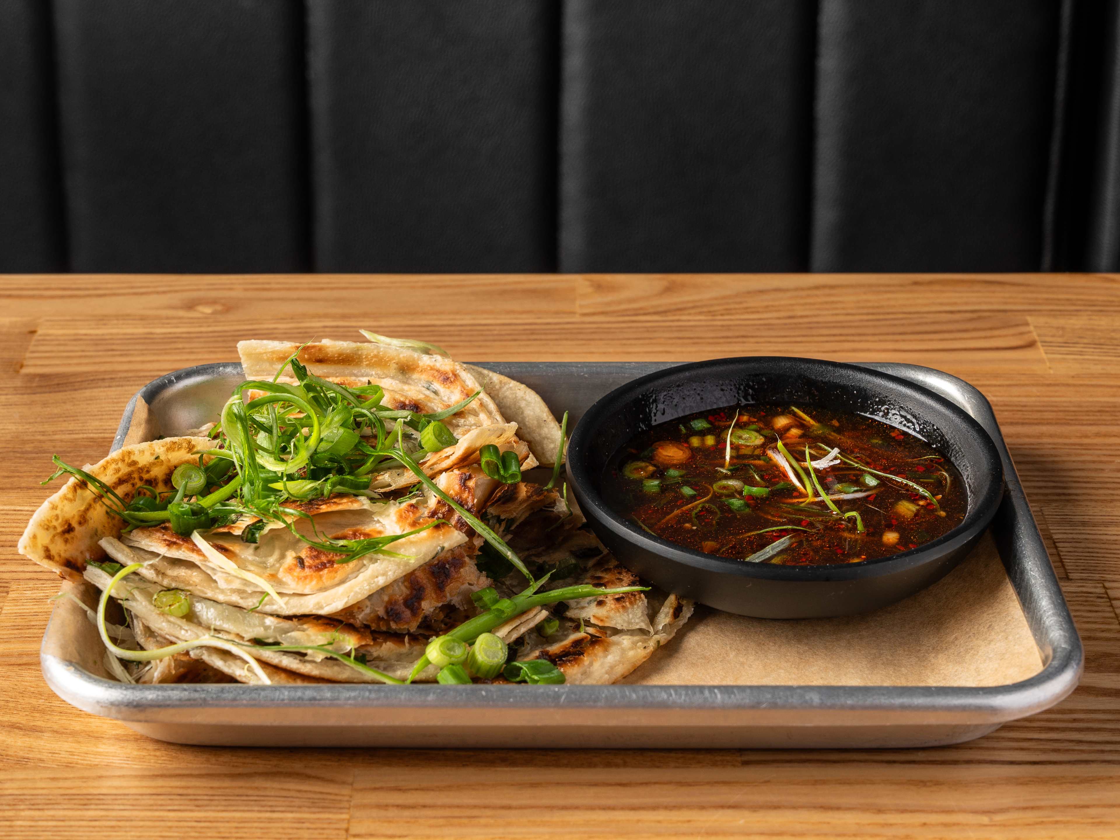 A crispy scallion pancake.