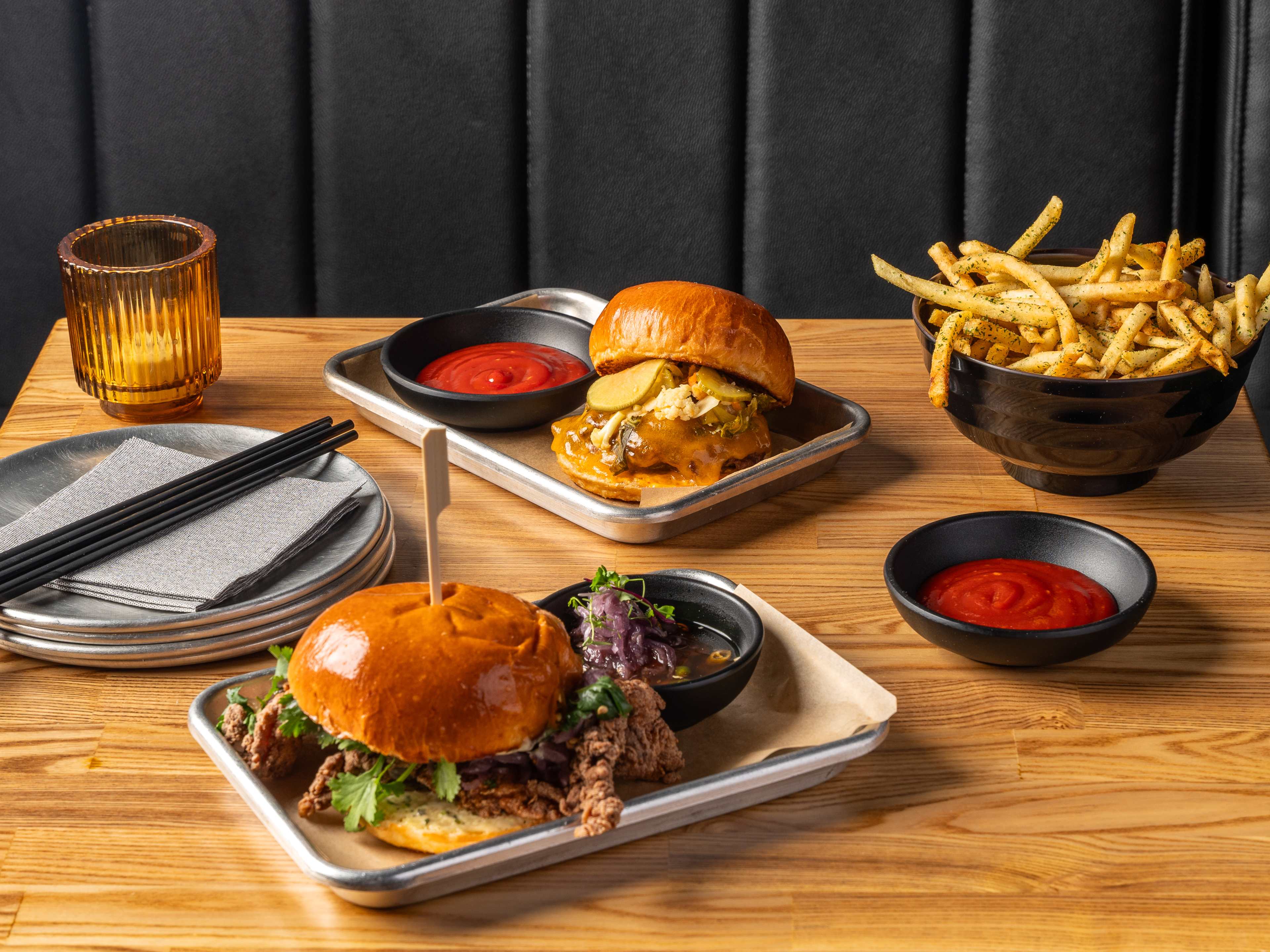 Fries, a fried chicken sandwich, a smashburger, and gochujang ketchup.