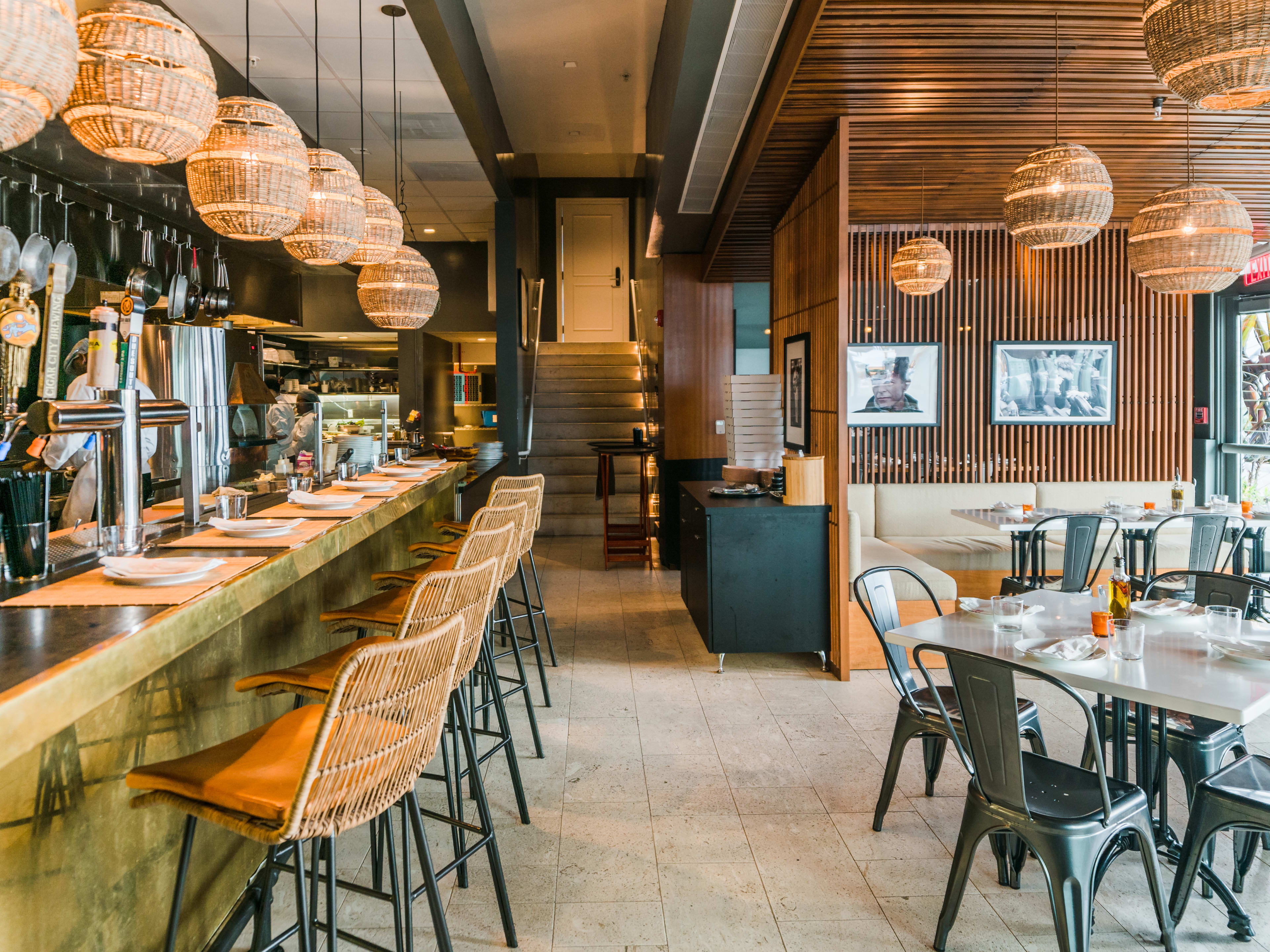 interior with bar and table seating and modern boho decor