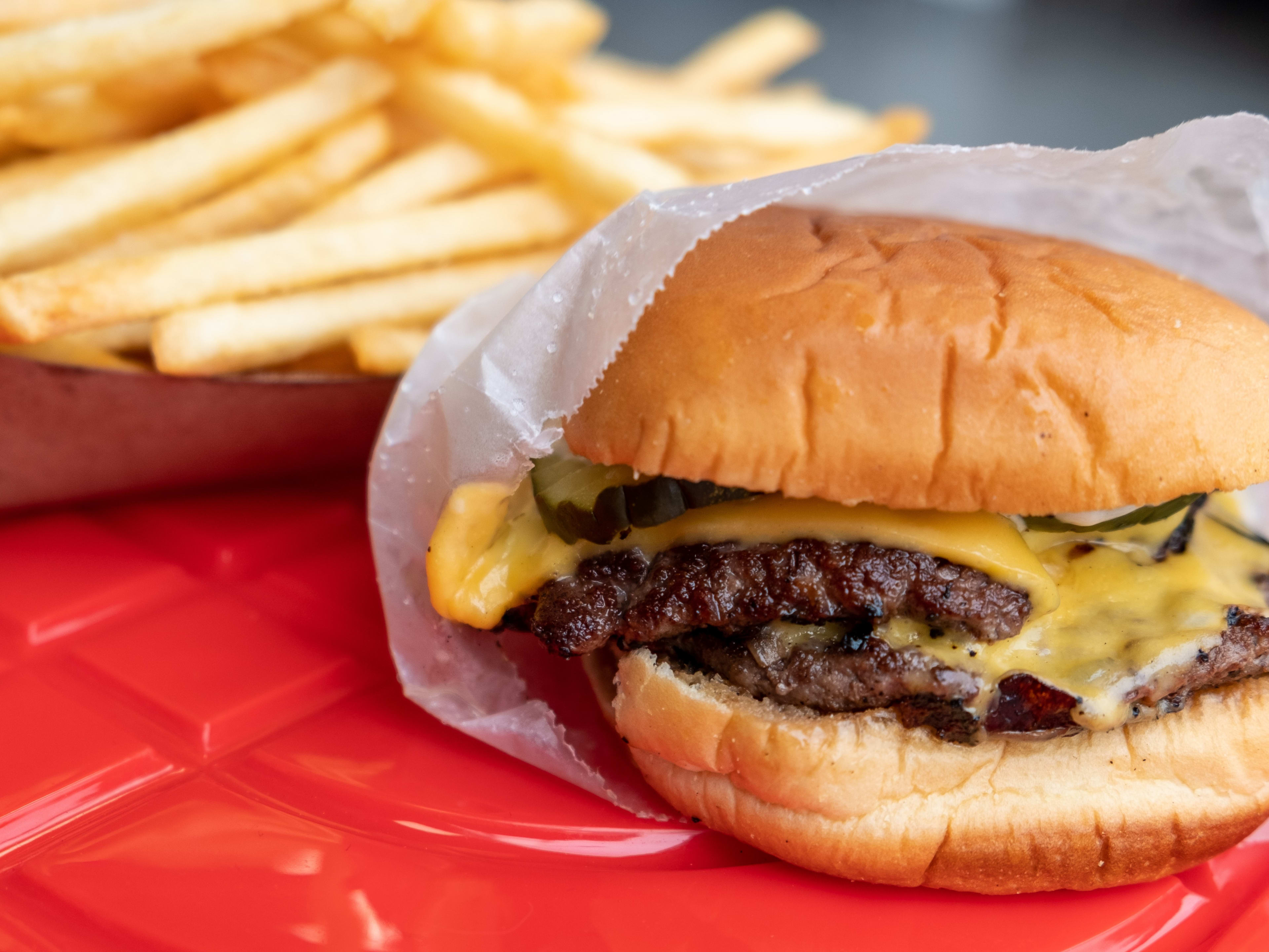 Smashburger on trays with fries