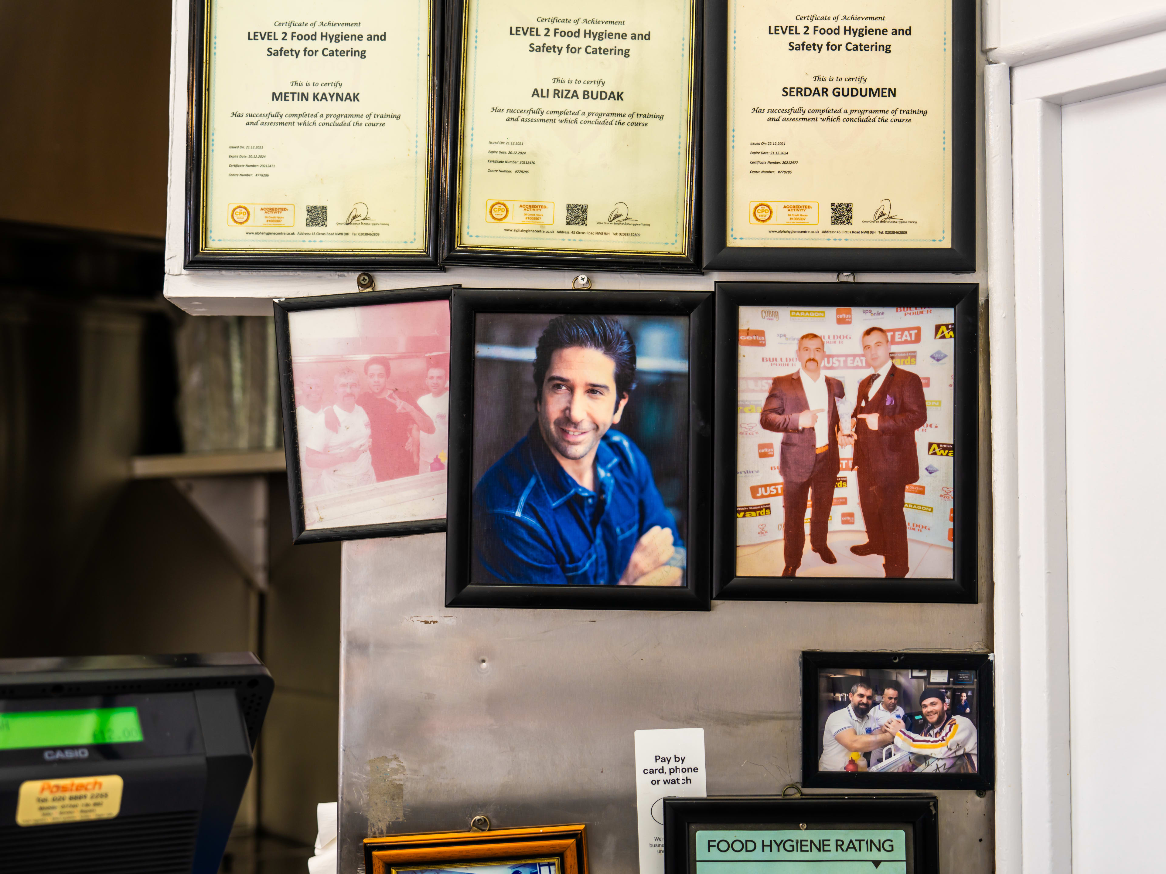 The wall of famous fans who've visited The Best Turkish Kebab.