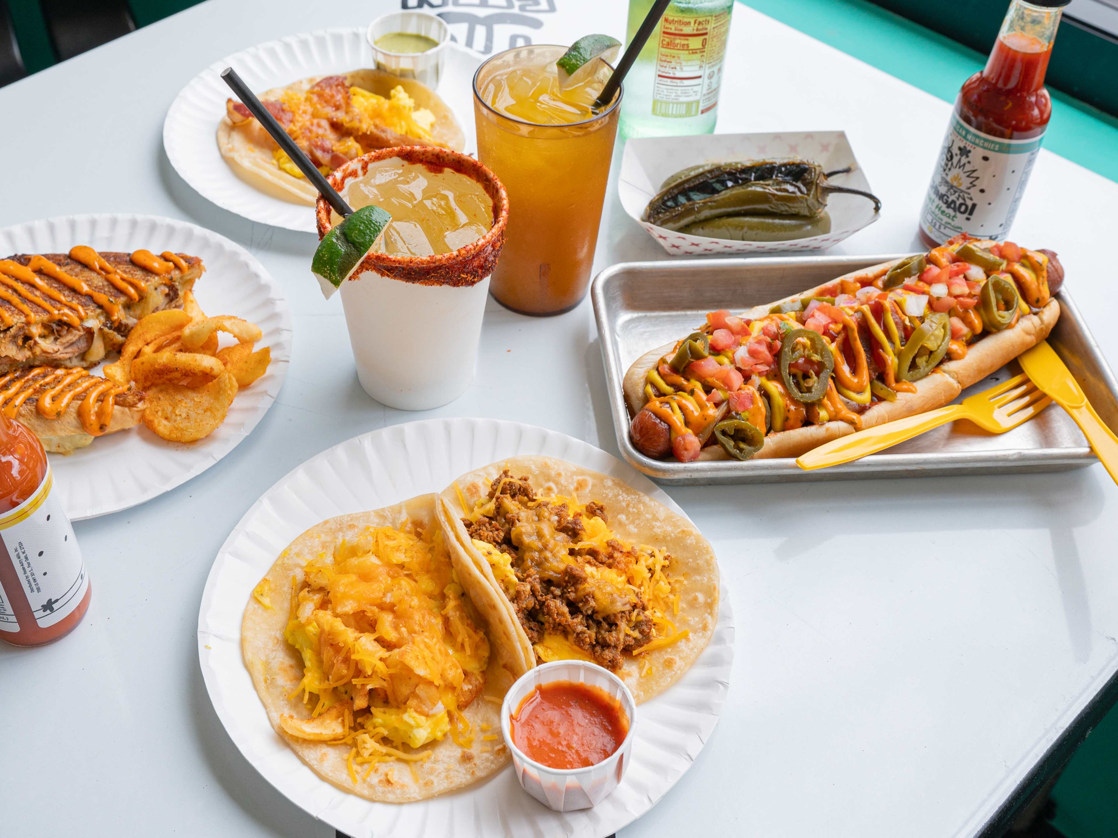 A spread of food and agua frescas from Tio Fun.