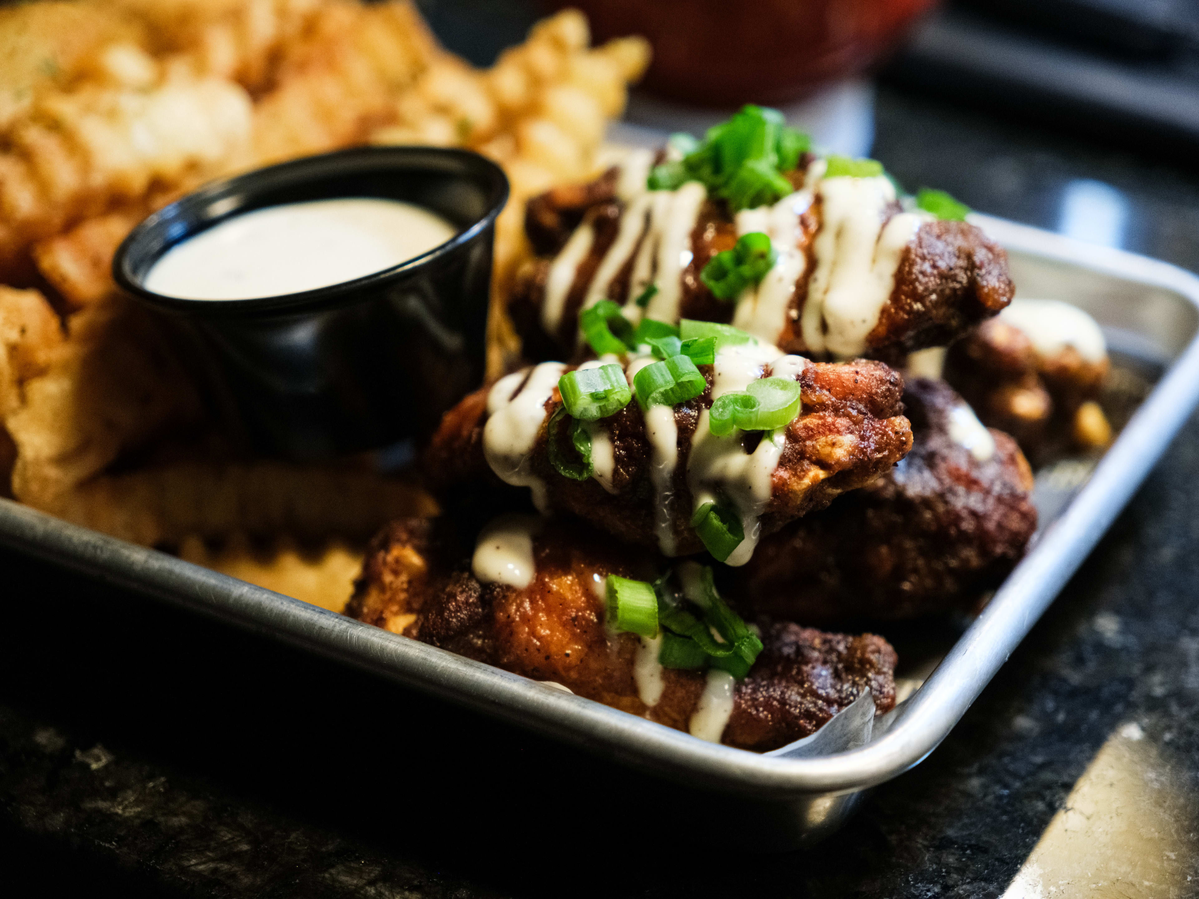 The suya wings and fries from Urban Smoke.