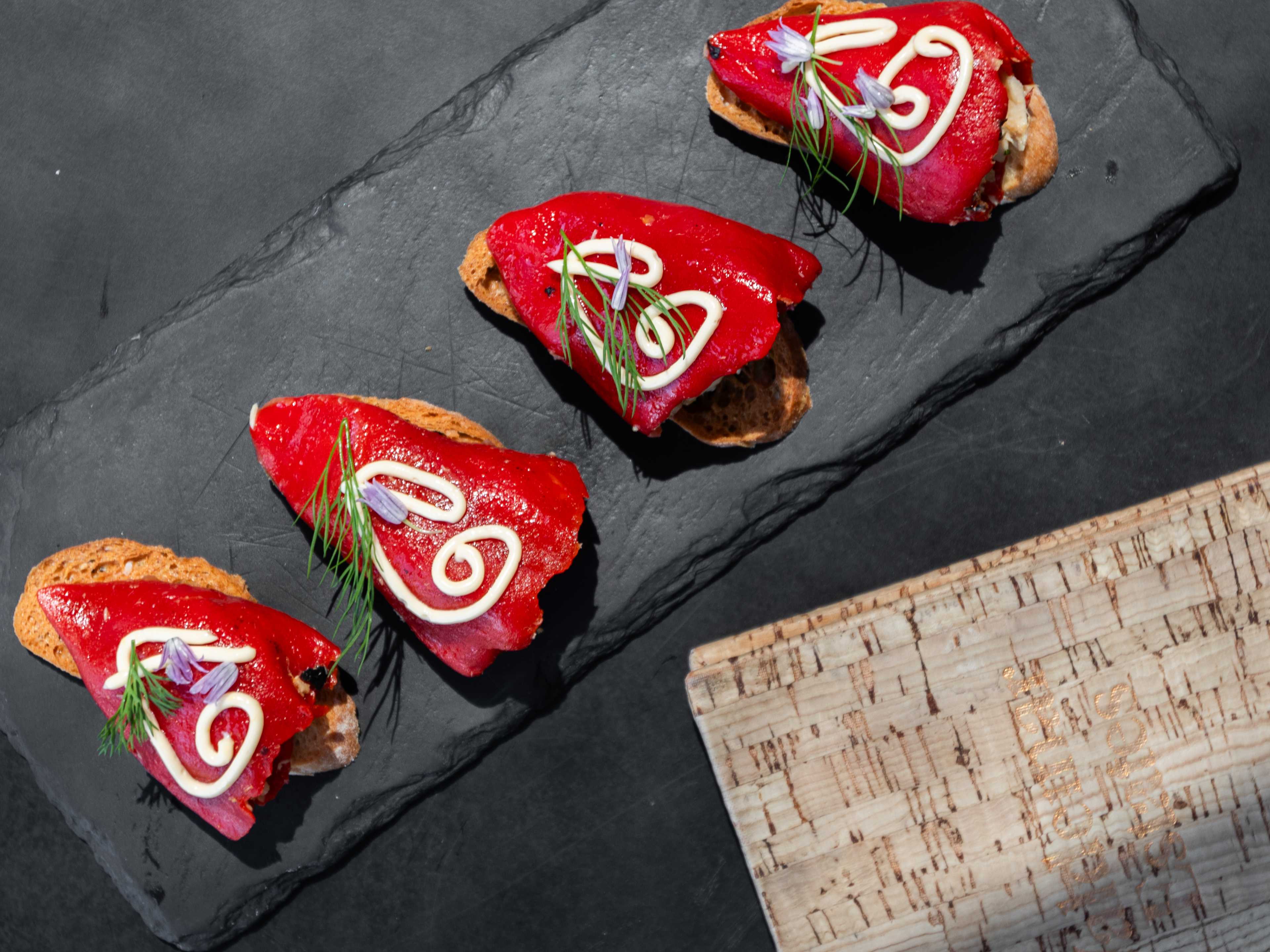 crostini topped with roasted peppers