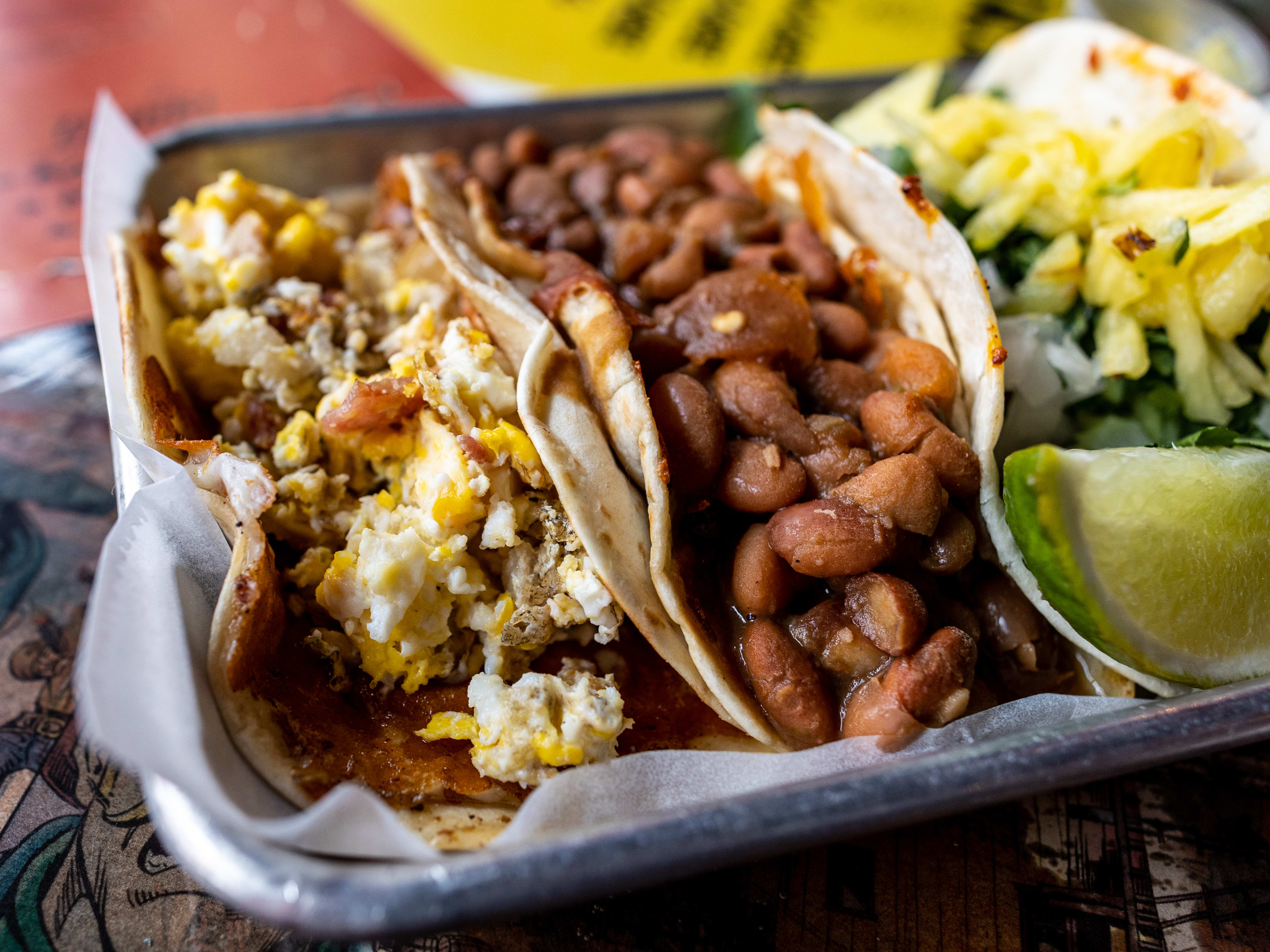 The breakfast taco, beans, and al pastor taco from Vaquero Taquero.